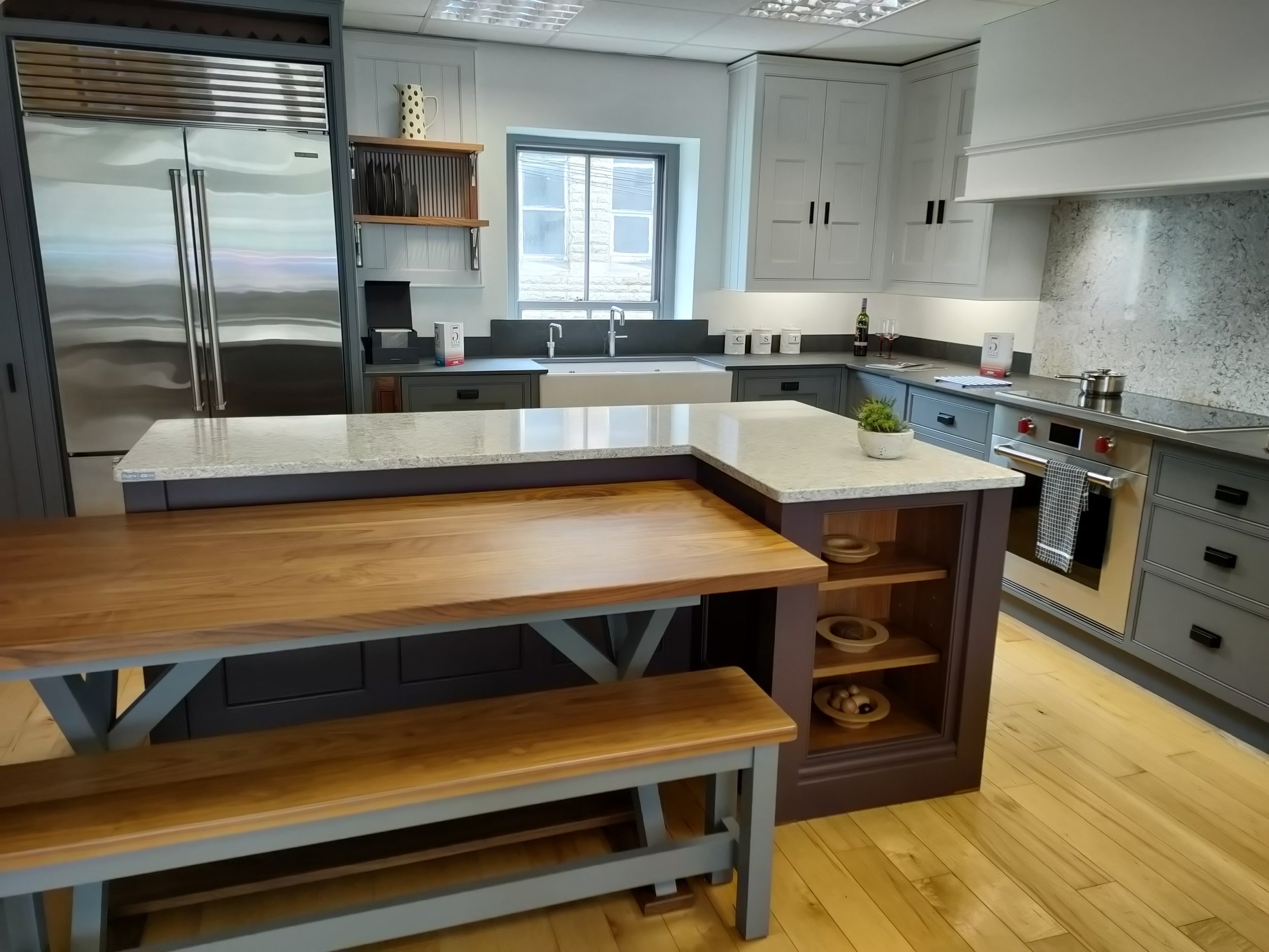 Walnut table with bench seat. Fitted into the island unit and can be easily pulled out and moved