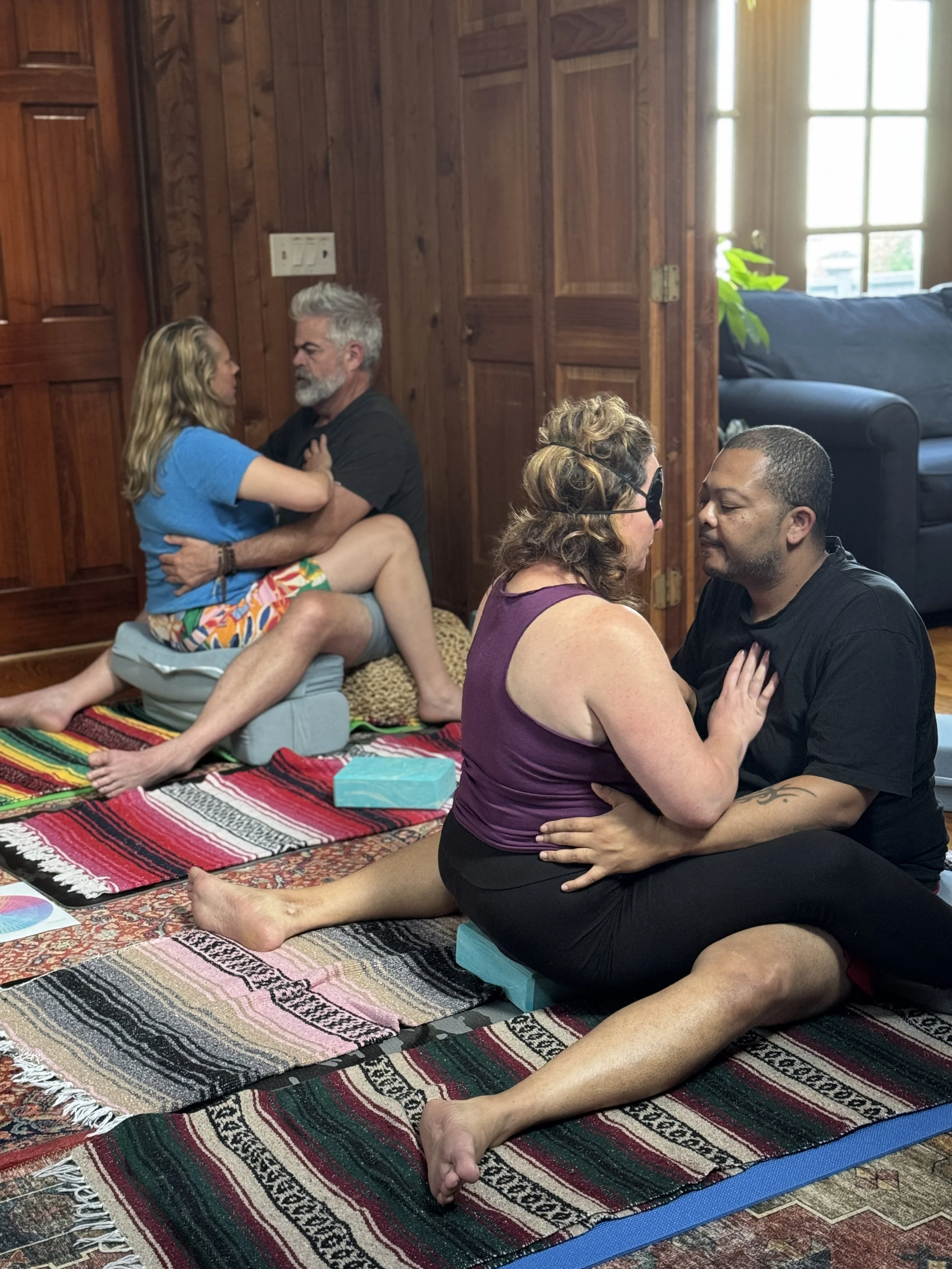 Couples embracing and engaging in breathing exercise