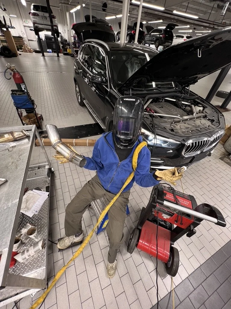 Me! Welding a wastegate/hood exhaust for my friend's drift car.