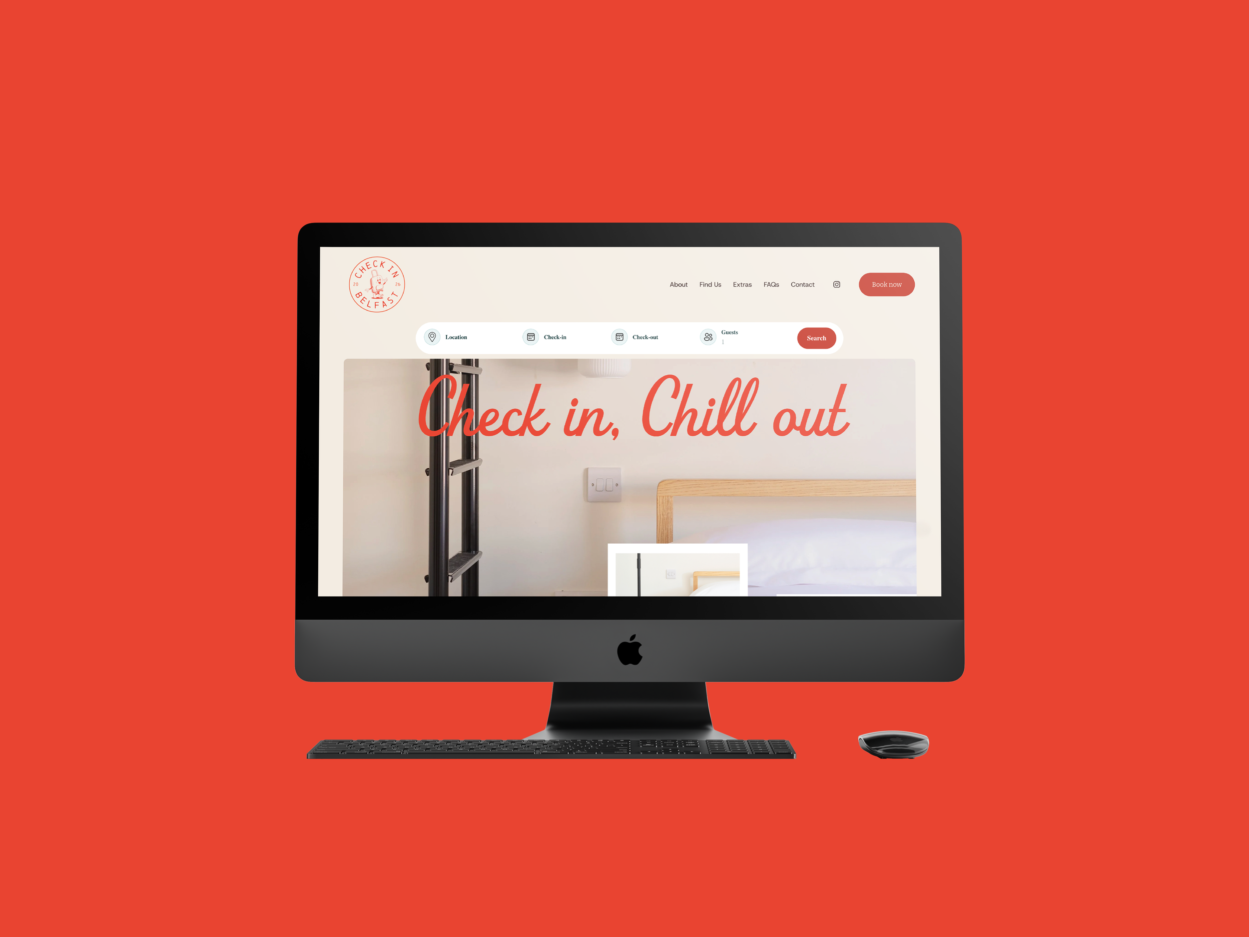 Apple iMac computer with a black keyboard and mouse on a red background, displaying a hotel check-in website