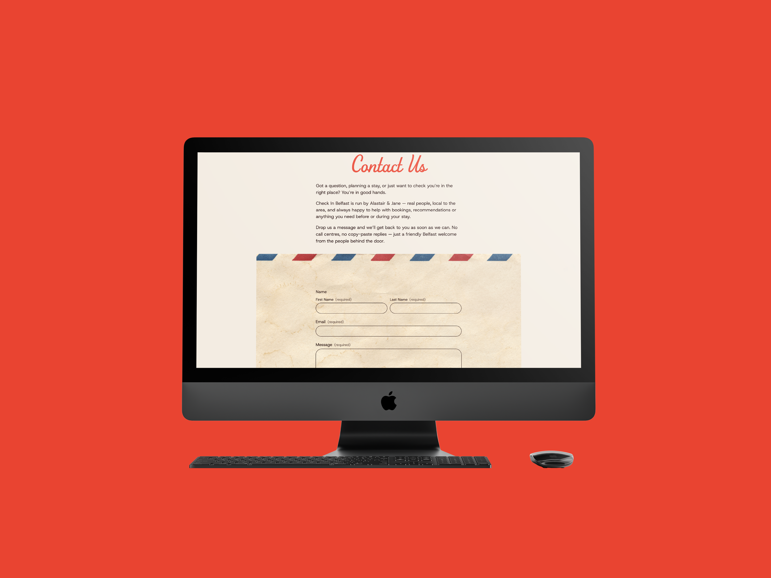 An Apple iMac computer displaying a contact us webpage on a bright red background.
