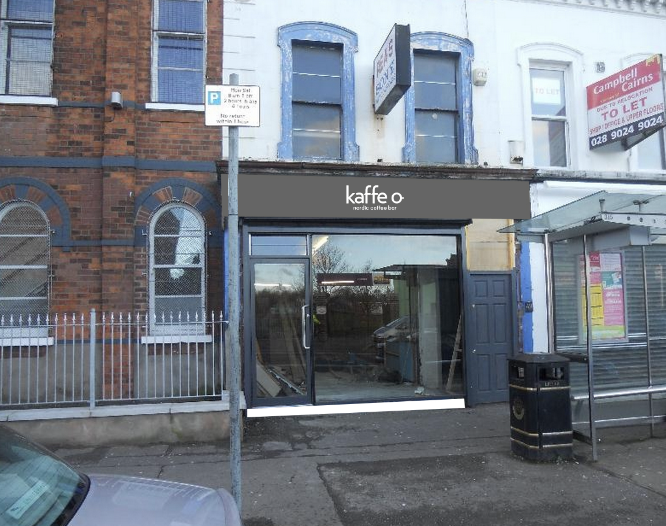 A street scene with a storefront named 'kaffe' and signage for a northern coffee bar. There is a bus stop with a shelter and a trash bin outside. Adjacent buildings include a brick building with barred windows and a white building with a sign for Campbell Cairns. A car is partially visible at the left bottom corner.
