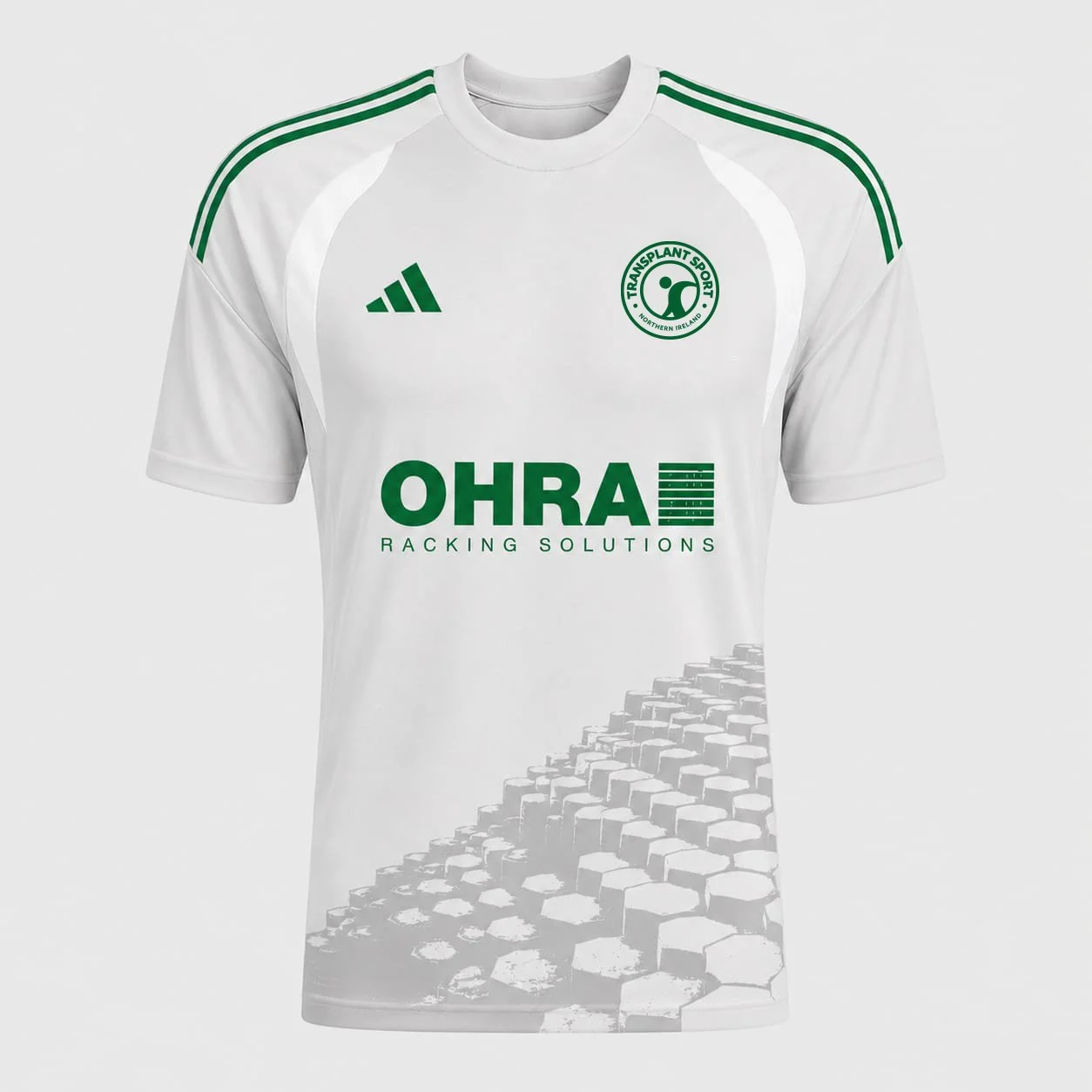 White sports jersey with green accents, featuring a logo of Transplant Sport, Adidas logo, and a sponsor logo of OHRA Racking Solutions, with a pattern of hexagonal tiles on the lower part.