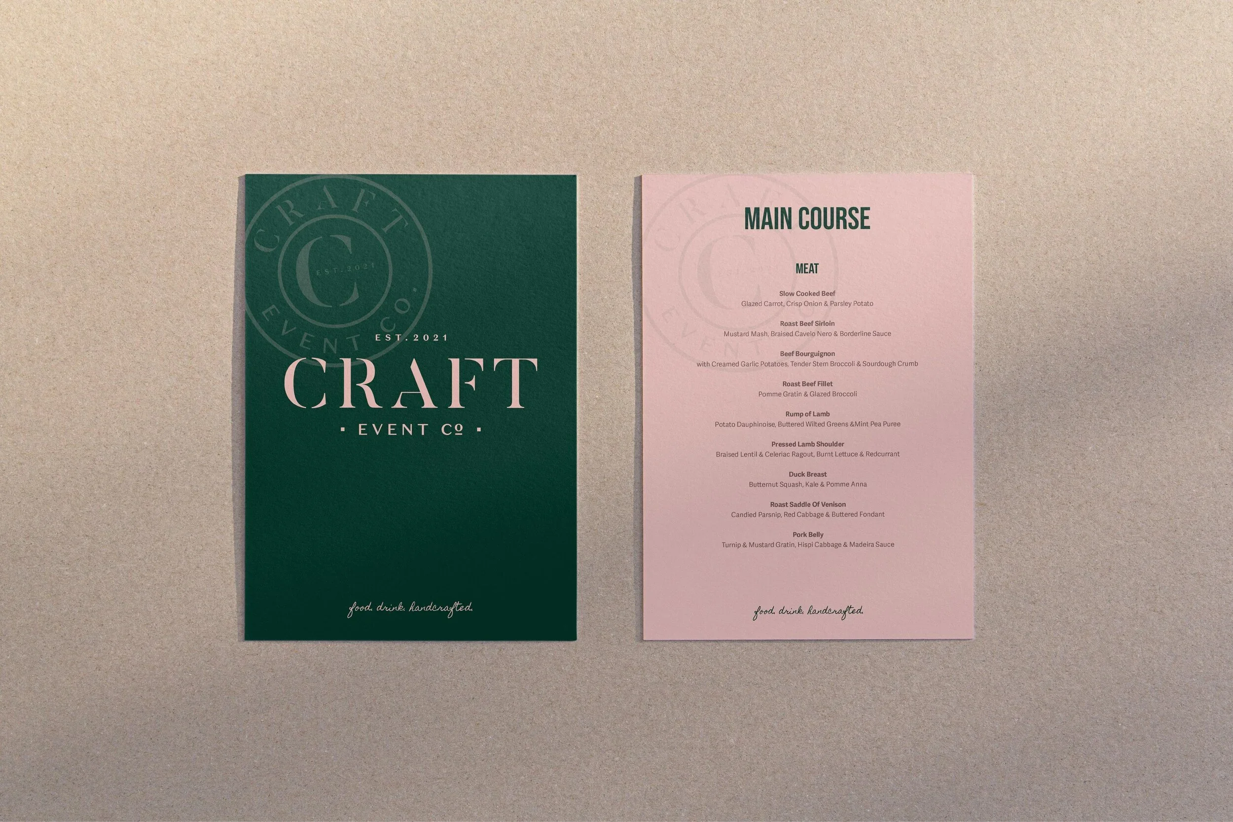 Two menus for a craft event. The left menu is dark green with a circular logo that says "Craft Event Co. EST. 2021" and features the word "CRAFT" in large letters. The right menu is light pink with black text, listing main courses including various beef, lamb, and pork dishes, with descriptions.
