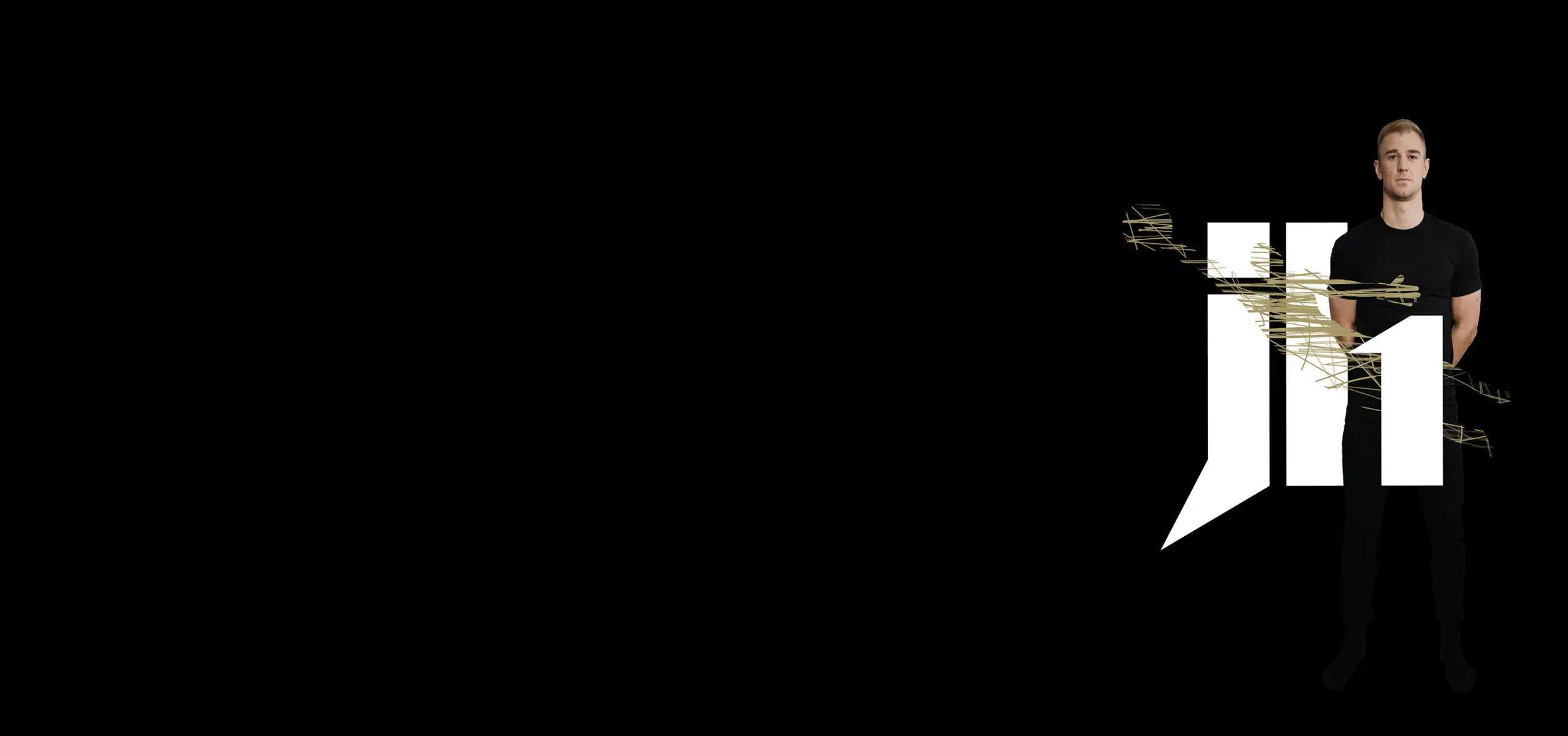 A man in a black t-shirt standing next to a large black background with white and black geometric shapes and gold abstract lines.