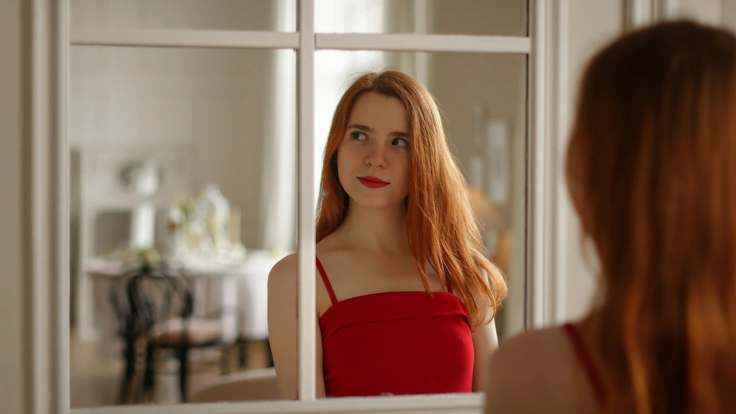 girl in front of his mirror looking