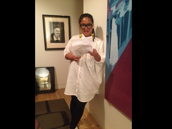 Hosannah Assuncion reading her poetry in the bedroom at Benefit Event