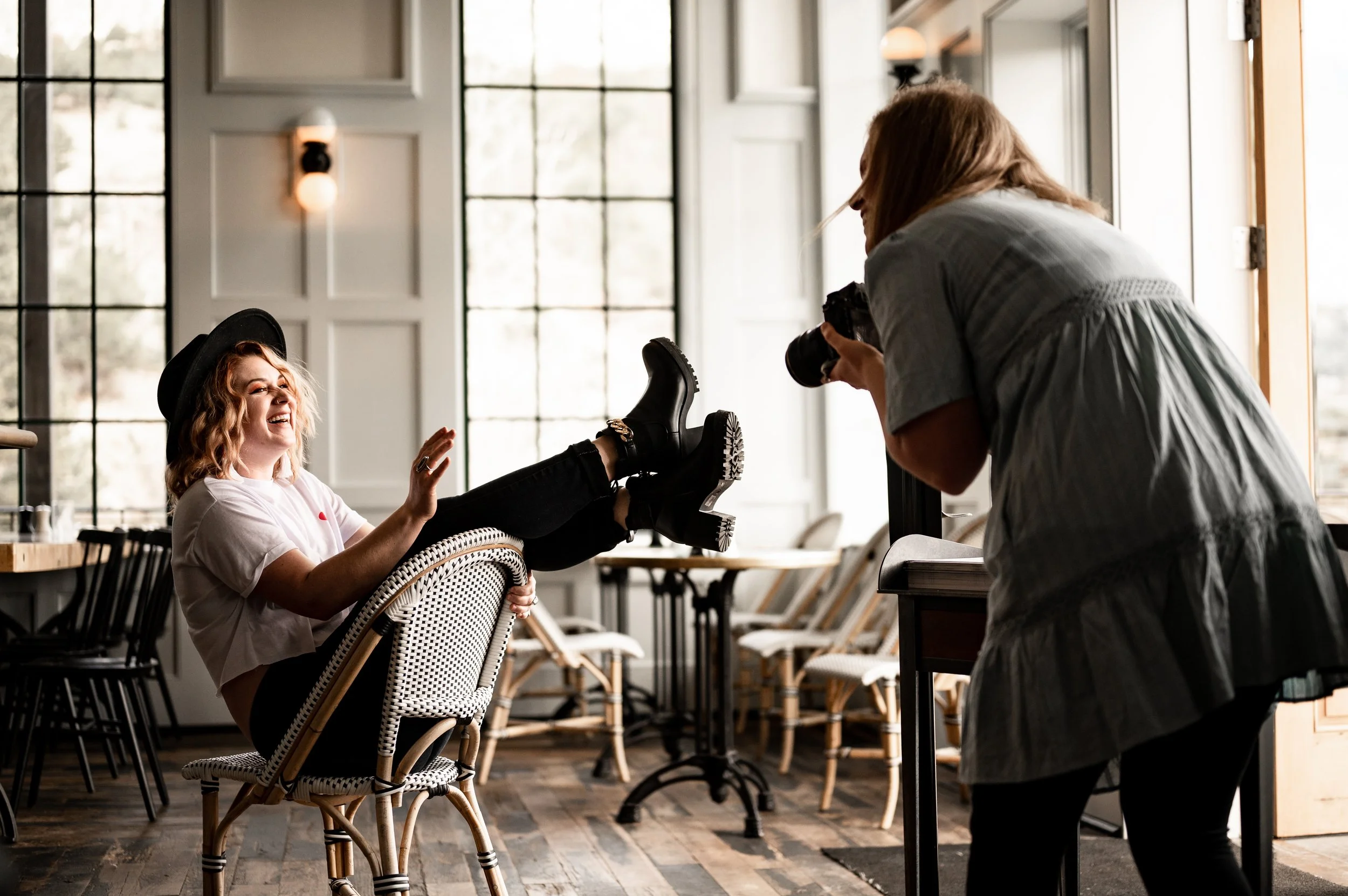 Two photographers behind the scenes during a branding photoshoot.