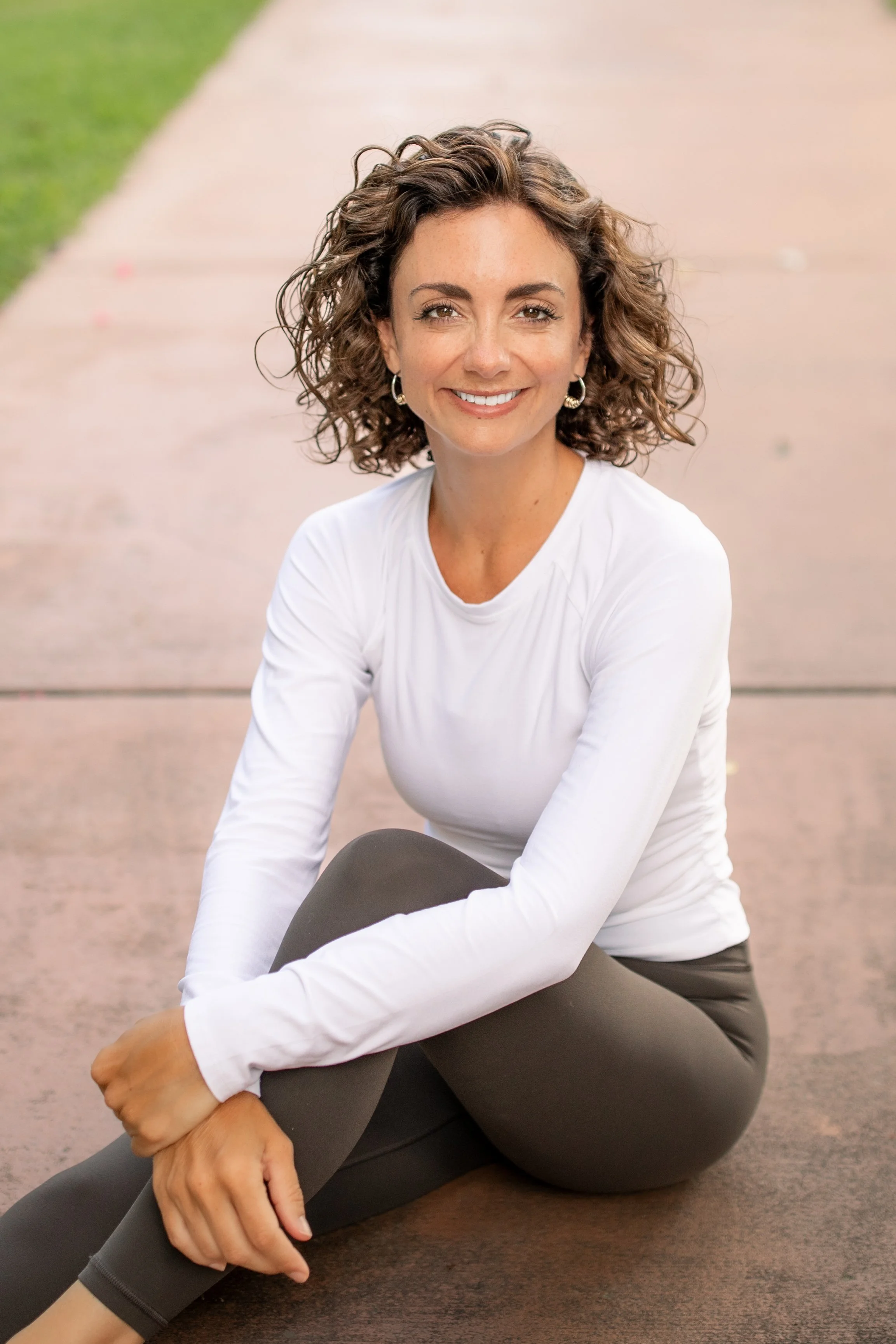 Pilates instructor posing casually for a lifestyle headshot. 