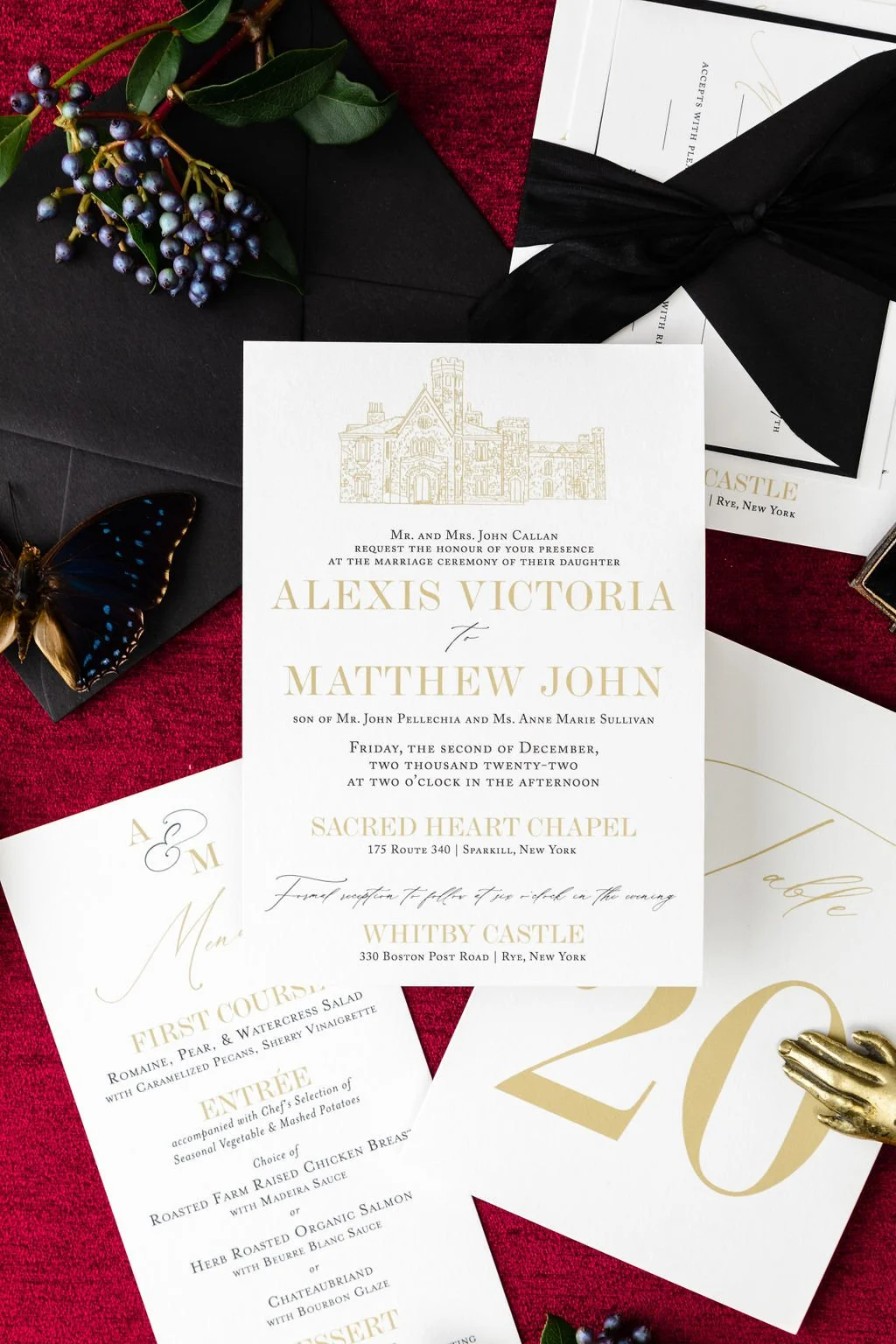 gold and black elegant wedding invitation with whitby castle illustration.
