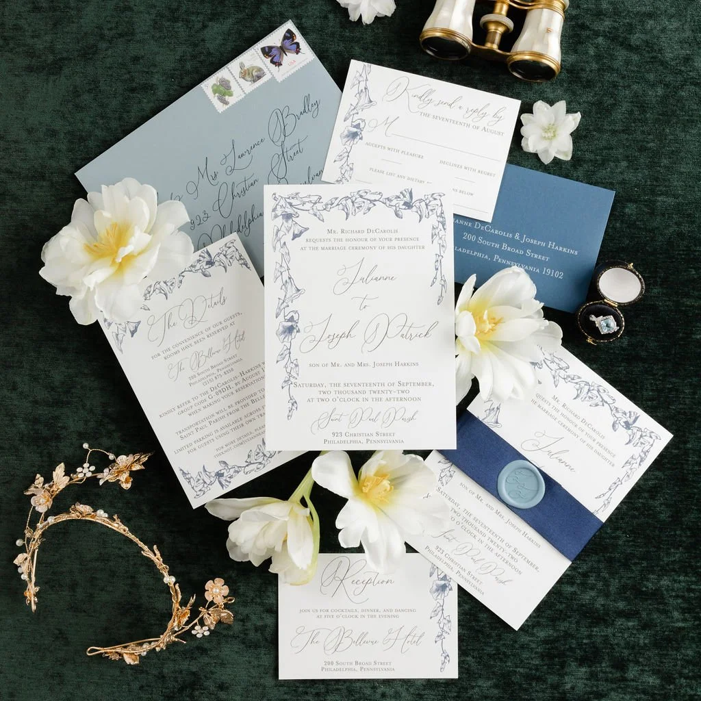 romantic floral wedding invitation with hanging florals and fine script.