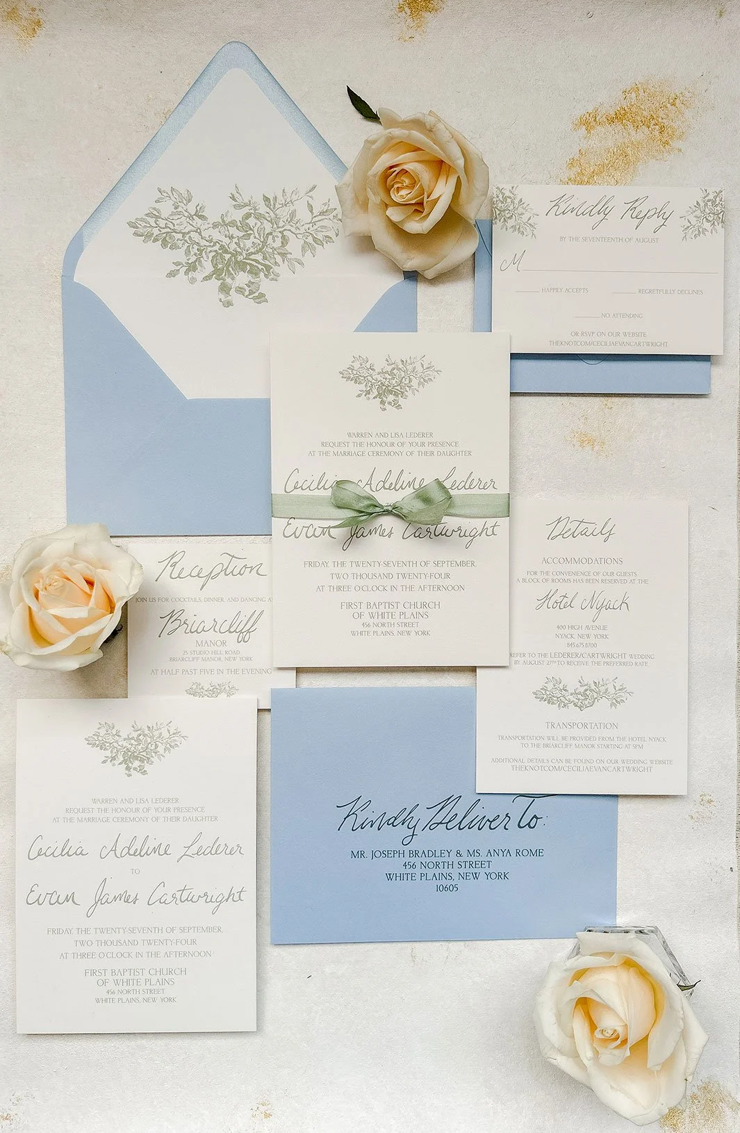 sage green and light blue wedding invitation with bow