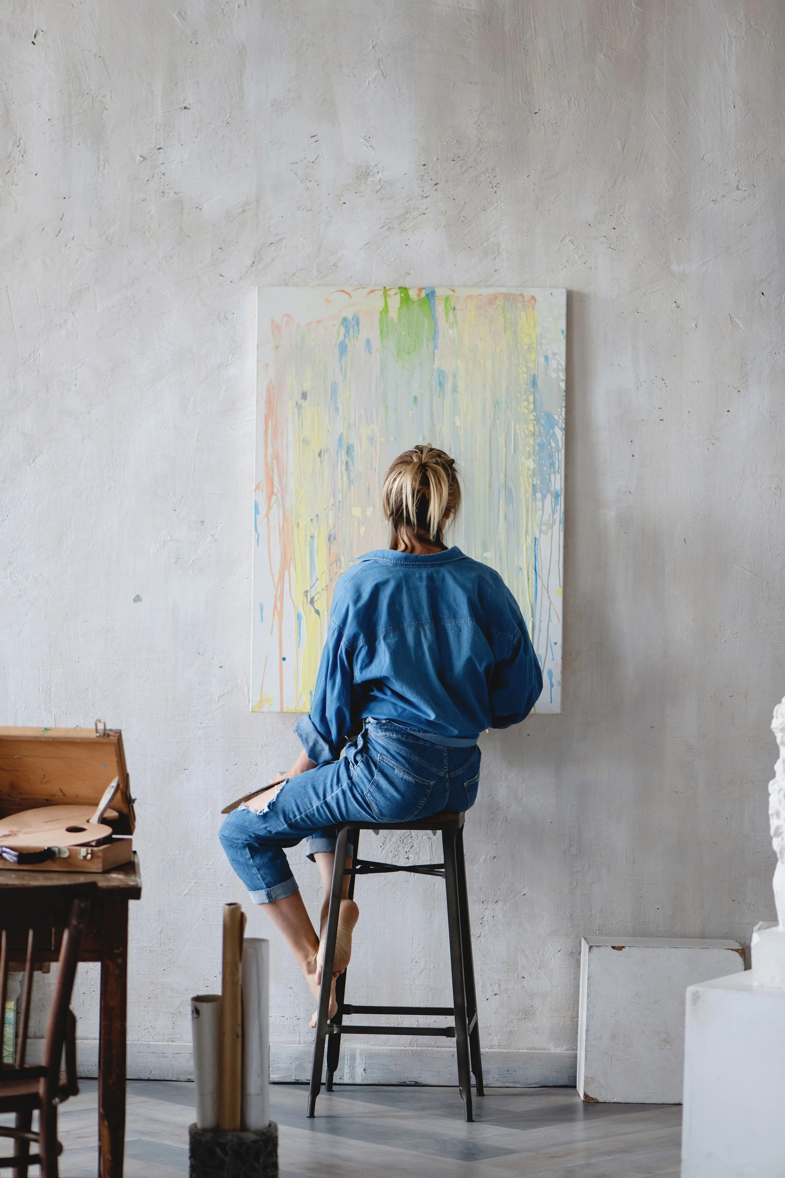 artist with abstract canvas