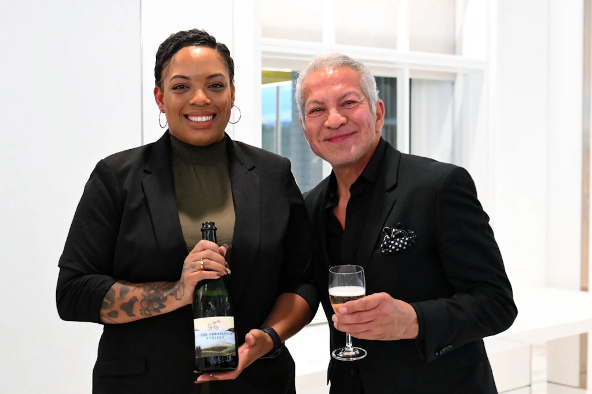 Brenae Royal and Javier Palomarez, holding wine bottle Veraison Project