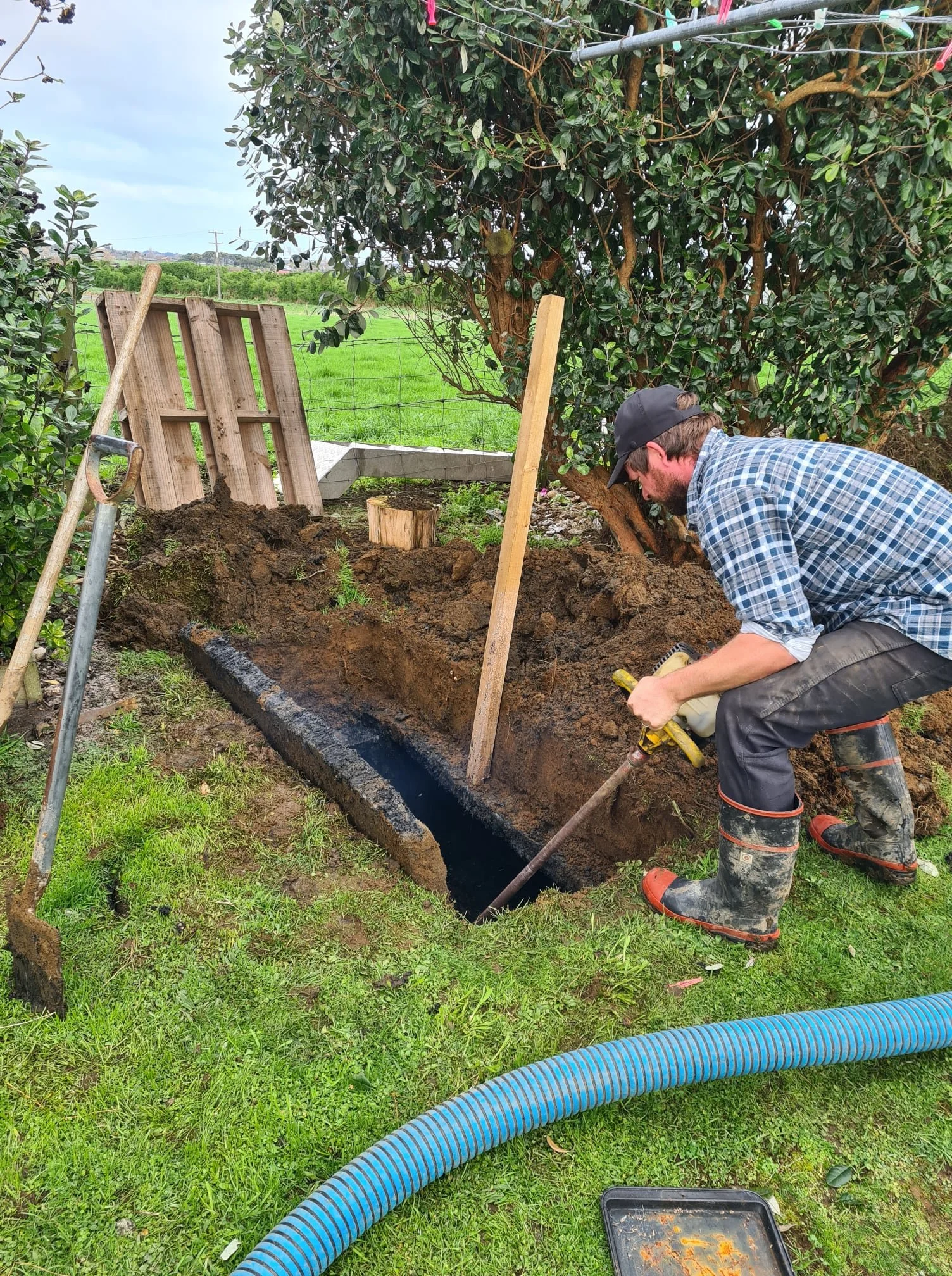 Septic Works staff cleaning a rural septic tank system