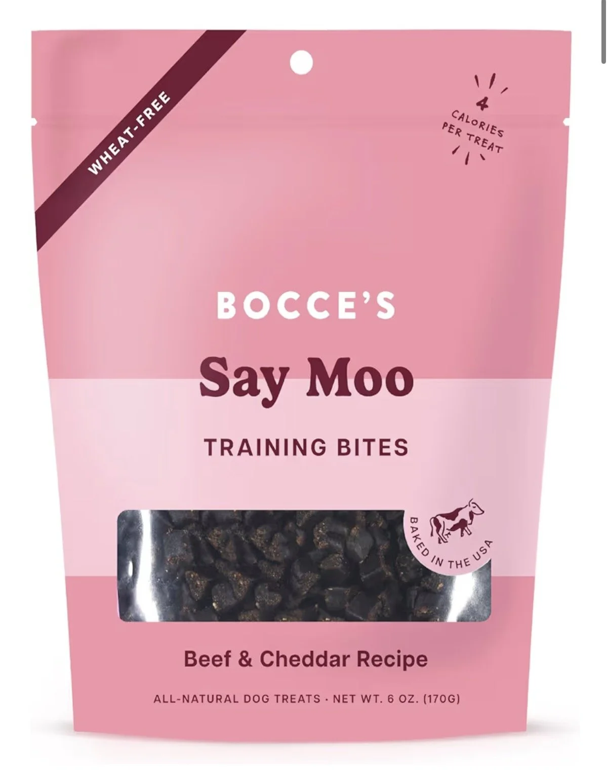 Pink packaging of Bocce's Say Moo Training Bites beef and cheddar flavored dog treats with a clear window showing dark treats inside. Label indicates they are wheat-free, 4 calories per treat, baked in the USA, and designed for training dogs.