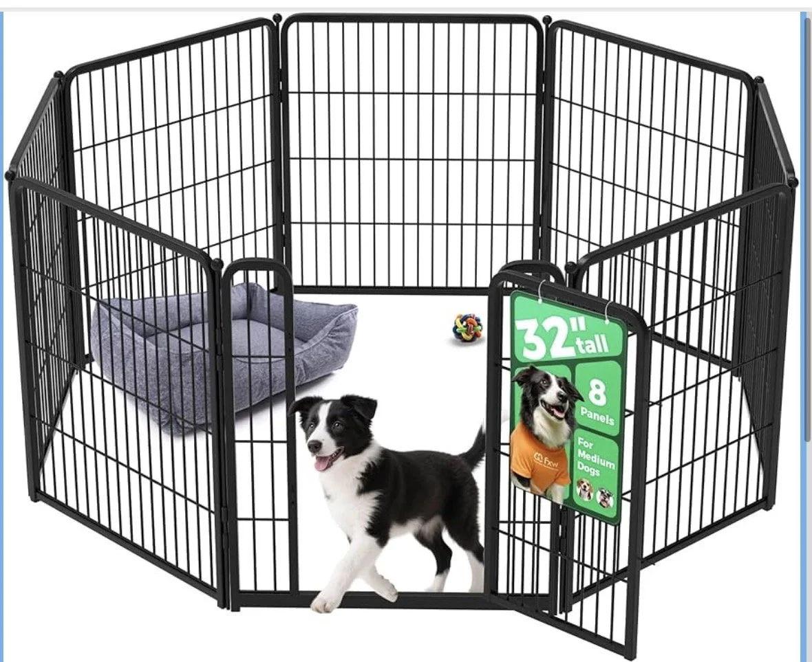 A black dog playpen with a door, a small puppy inside, a purple pet bed, and a colorful chew toy. There is a green sign on the door indicating it is 32 inches tall, has 8 panels, and is suitable for medium dogs.