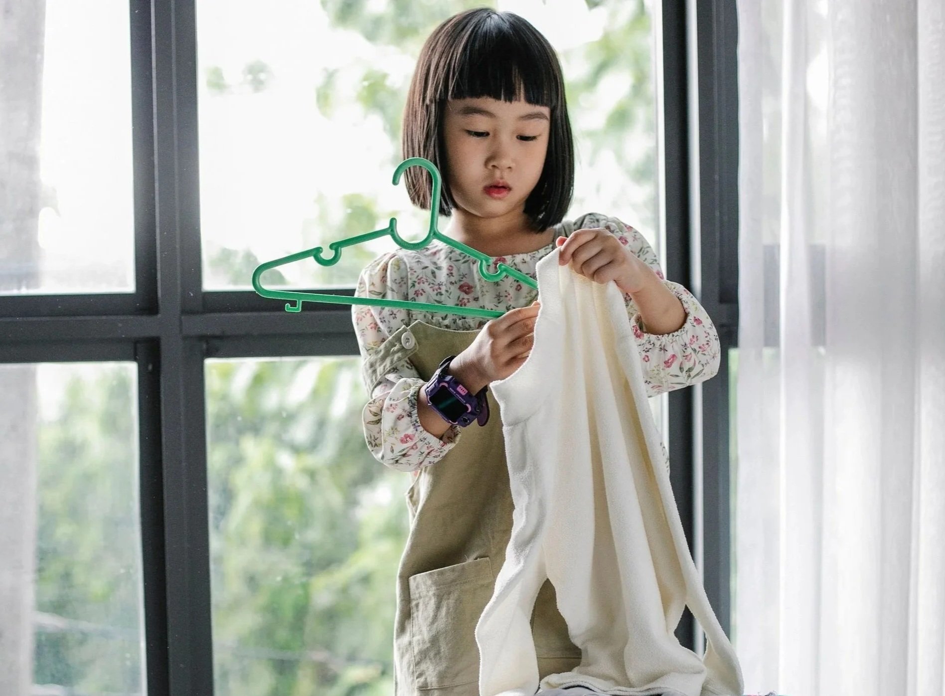 Child learning clothing organization and everyday independence.