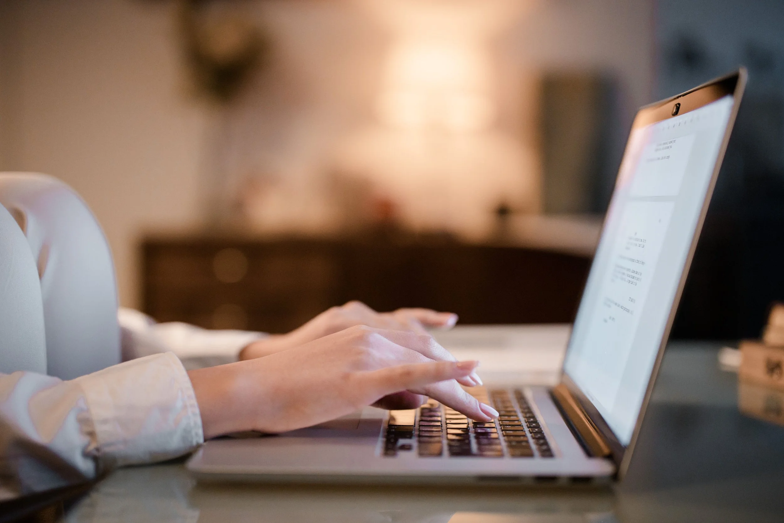 Household operations professional reviewing family schedules and routines on a laptop