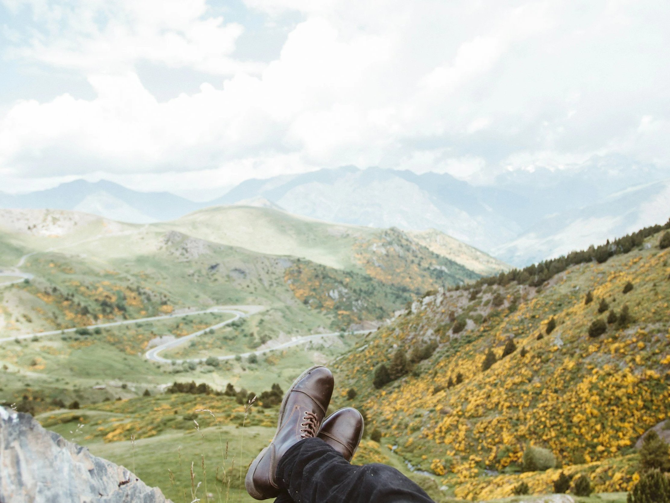 relaxing man's feet overlooking landscape