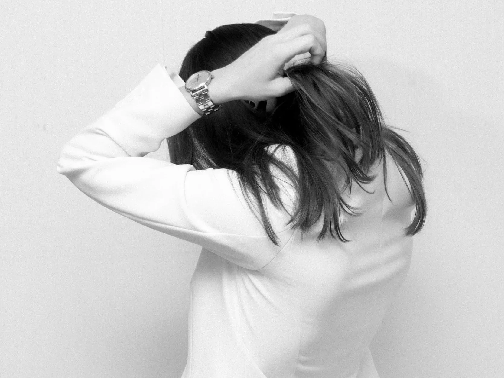 Busy frustrated woman facing away