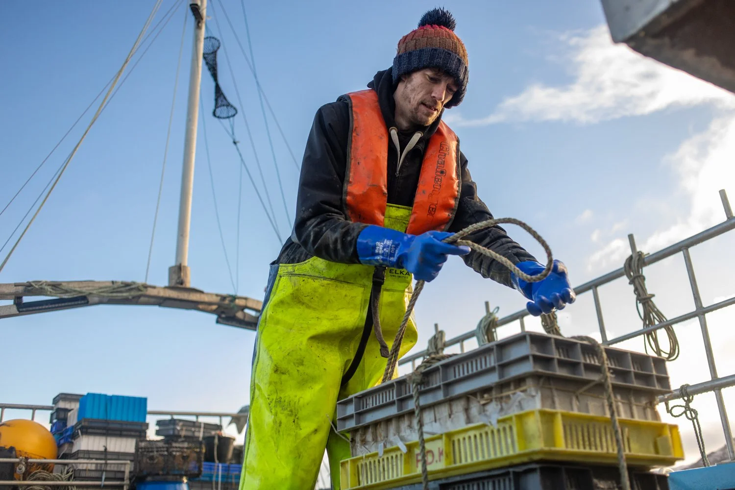 A crew member on Bally Philp’s boat stores prawns.
