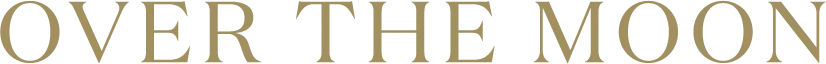 Partial view of the words 'OVER THE MOON' on a decoration or banner.