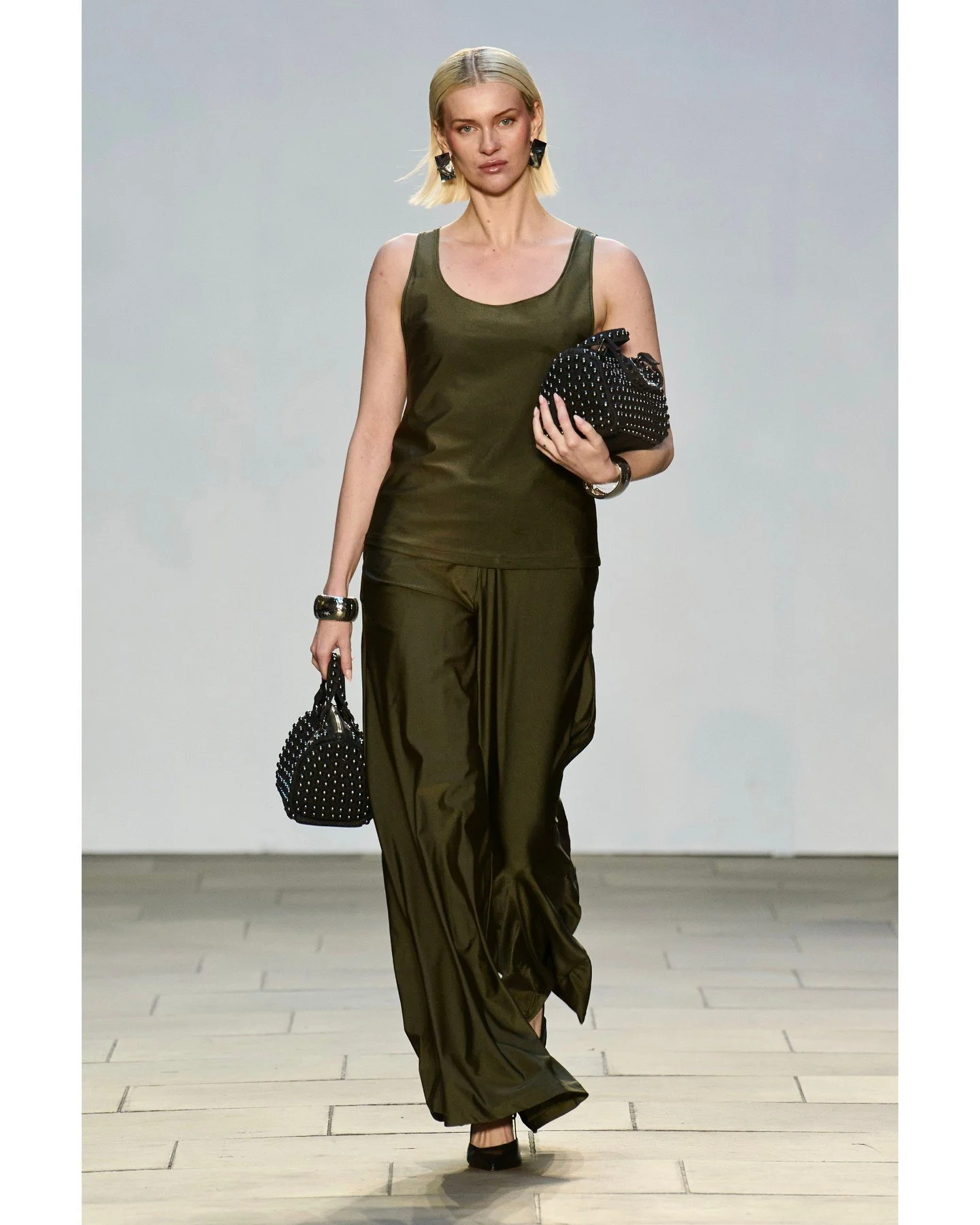 RIYSYS brought sculptural elegance to the runway with Shape of Self, a collection of statement bags rooted in Indian craftsmanship. Each piece was designed as more than an accessory &mdash; a dialogue between structure and soul, tradition and rebelli