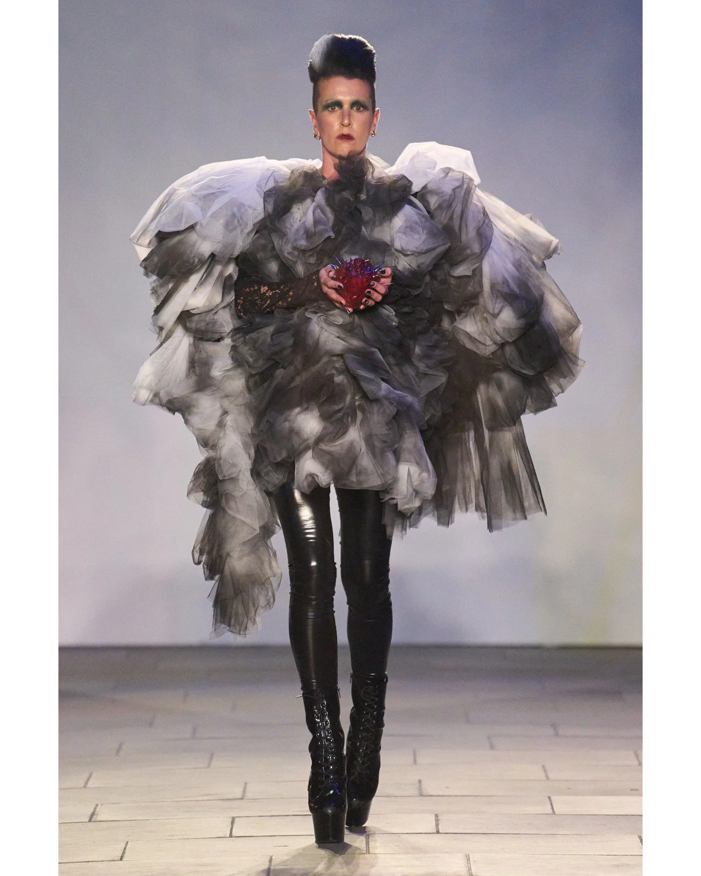 The collection drew on haunting references &mdash; X-rays, bone malformations, church iconography, and inkblot psychology &mdash; to create exaggerated, sculptural garments that felt like relics unearthed from cathedral ruins. Each piece was designed
