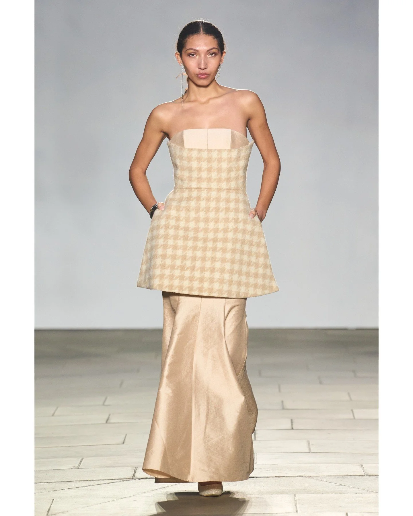 The collection reimagined classic feminine proportions through sculptural, flattering silhouettes.