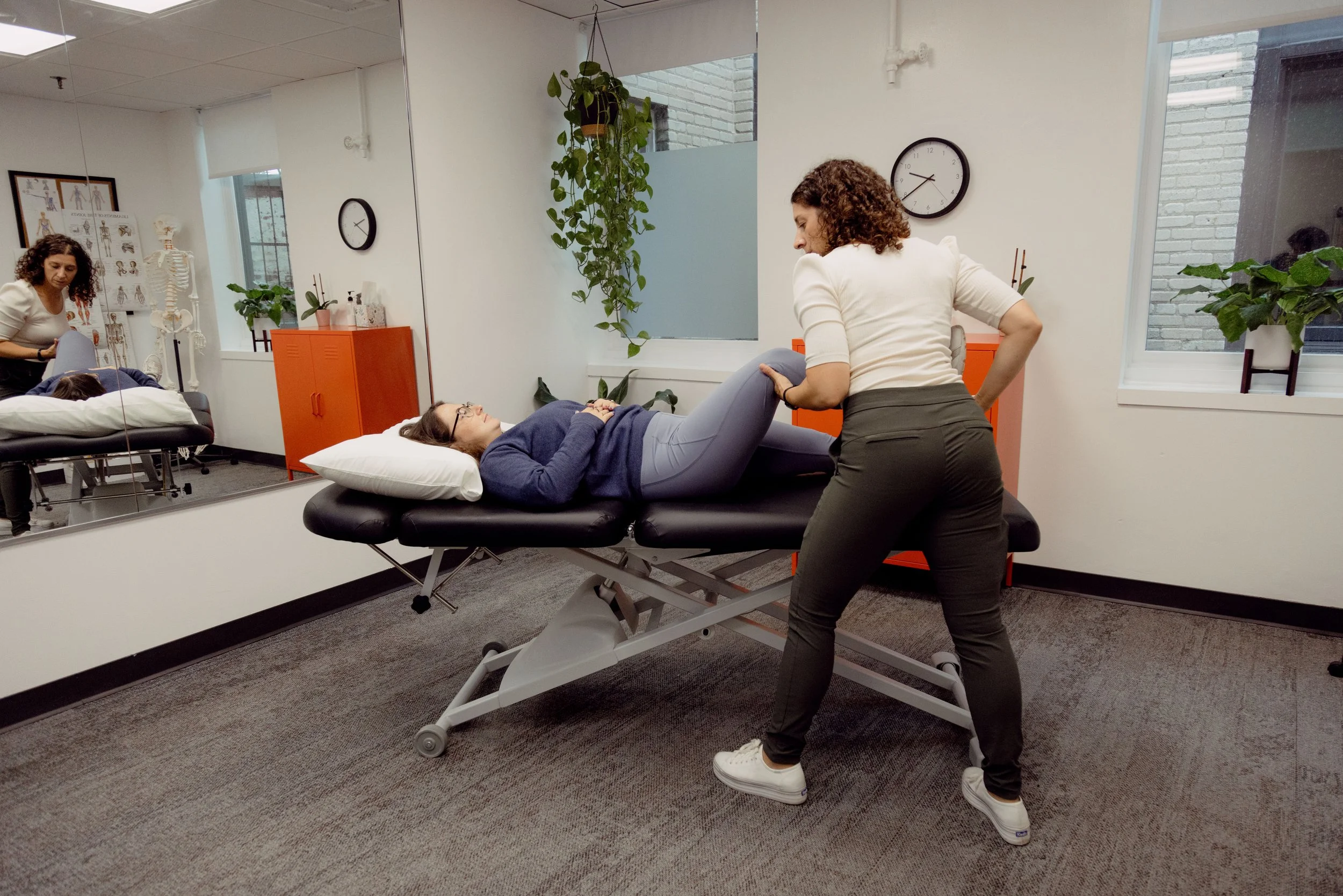 Patient working with a provider at a physical therapy clinic in Cambridge, MA during a one-on-one manual therapy session
