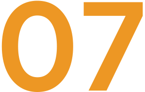 Close-up of the number '07' in orange color against a black background.