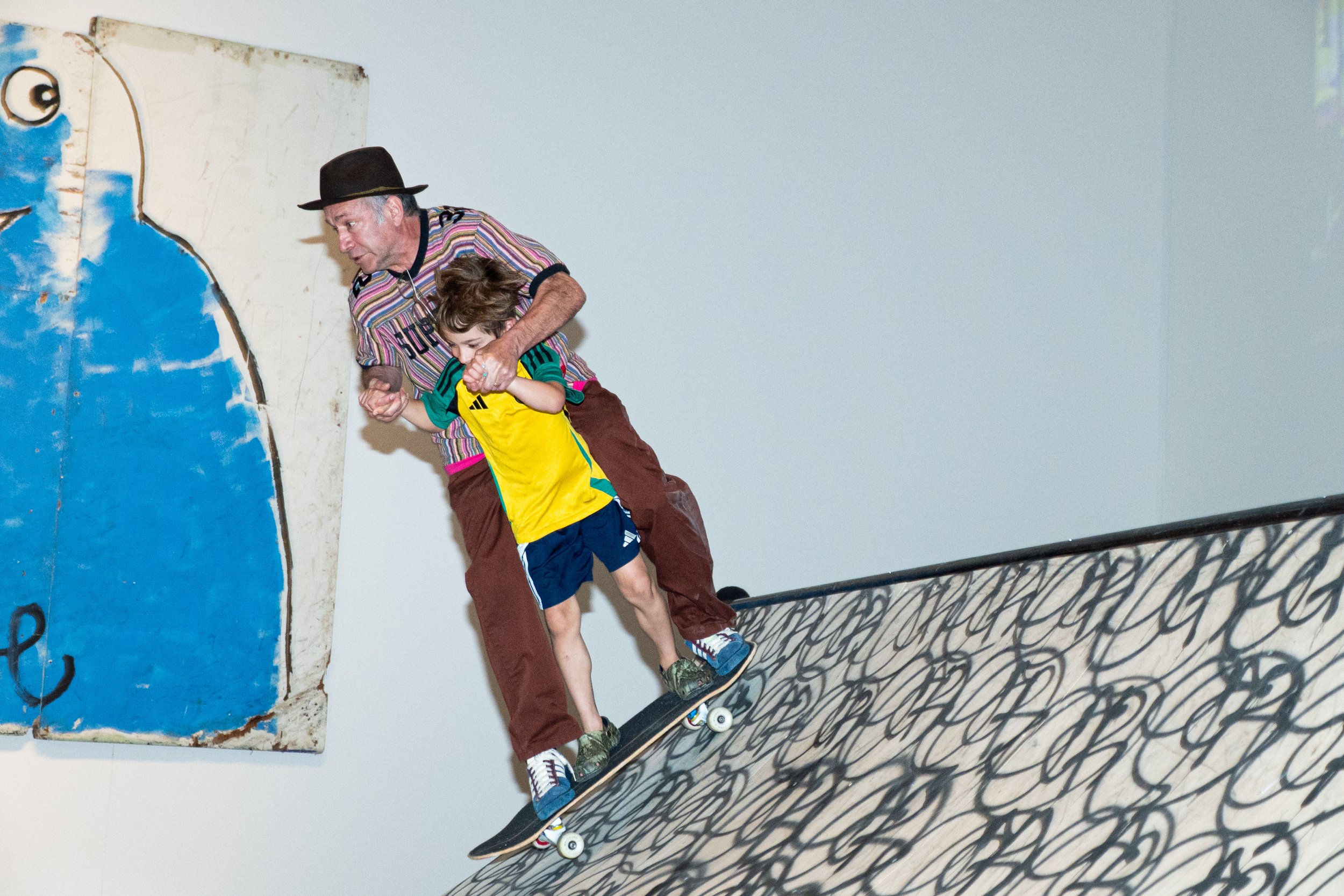 Artist Mark Gonzales skating inside the Dead End exhibit after the reveal of his statue 'Shmoo at Sunset'. June 7 2025, Syracuse NY. 