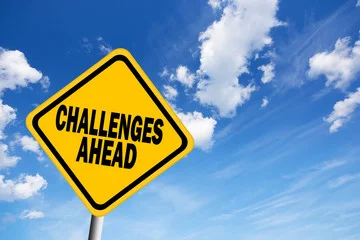 Challenges Ahead Street Sign