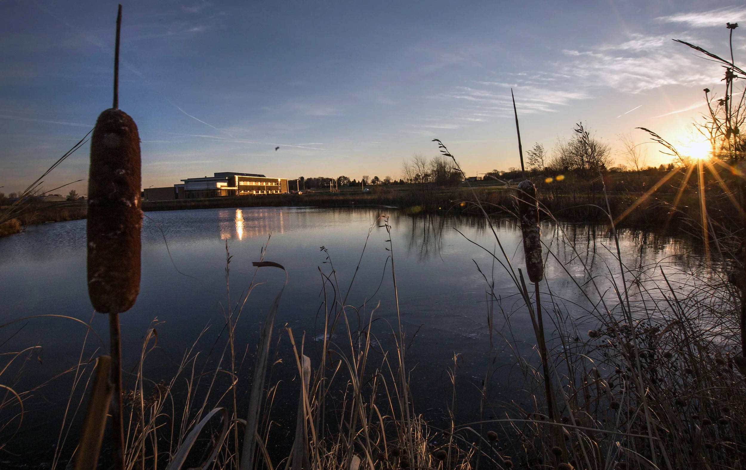 Exterior of Whitewater University Innovation Center with Pond at Dusk.jpg