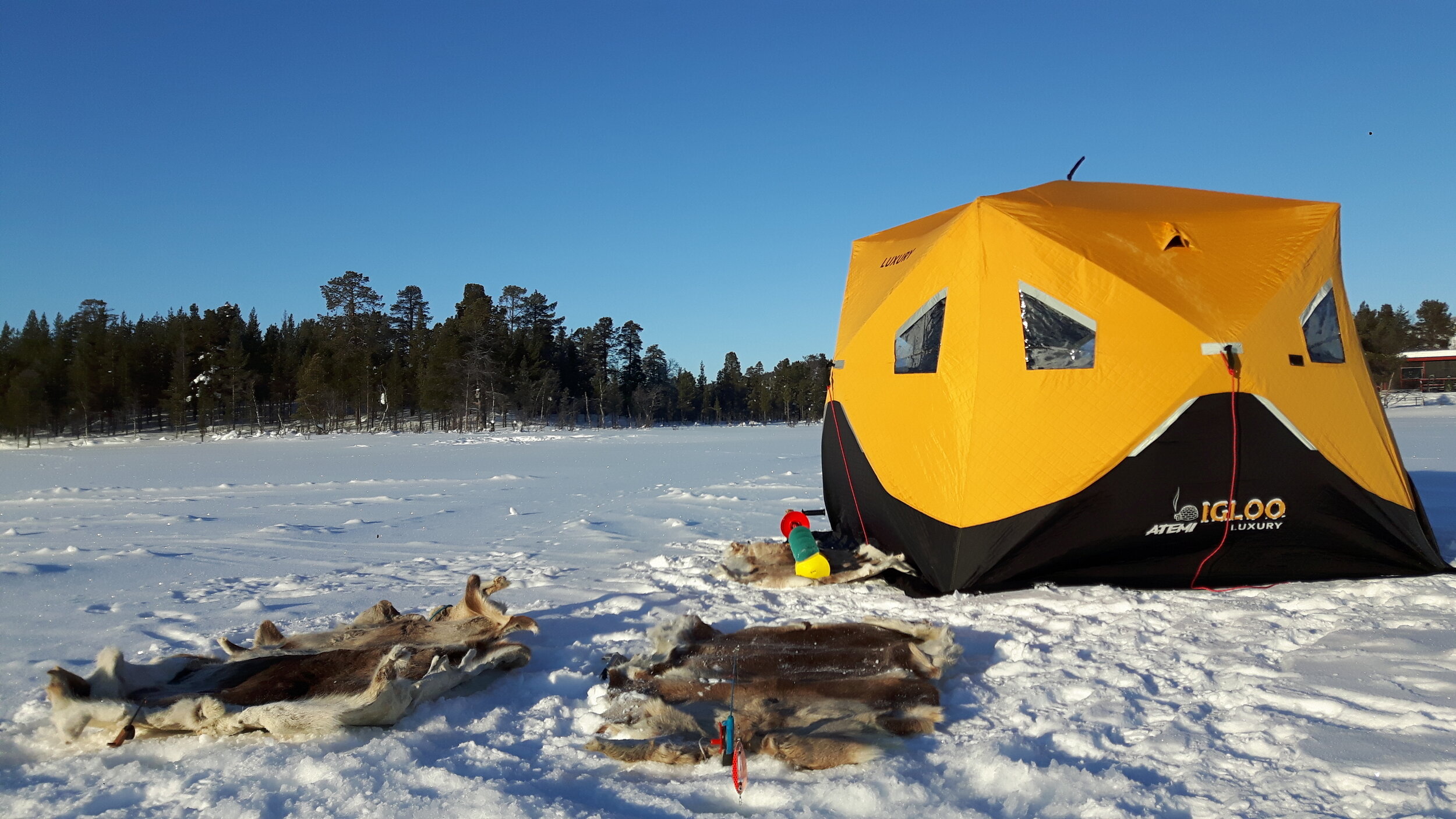 Ice fishing - wellness on ice - Kiruna Lappland