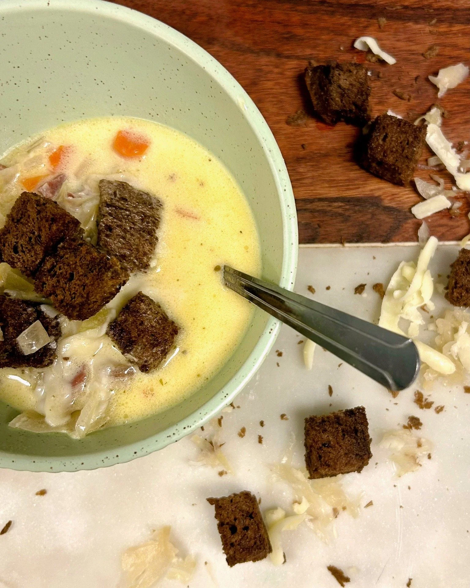 Stop in for a big bowl of comfort, perfect for a cold, snowy day. Our Reuben Soup is everything you love about the classic sandwich&mdash;warmed up, spoon-ready, and extra comforting. Packed with salty prosciutto, tangy sauerkraut, and rich Emmentale