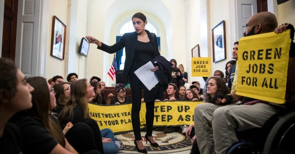01-05-19-green-new-deal-protesters-and-aoc-nyt-via-common-dreams (1).jpeg