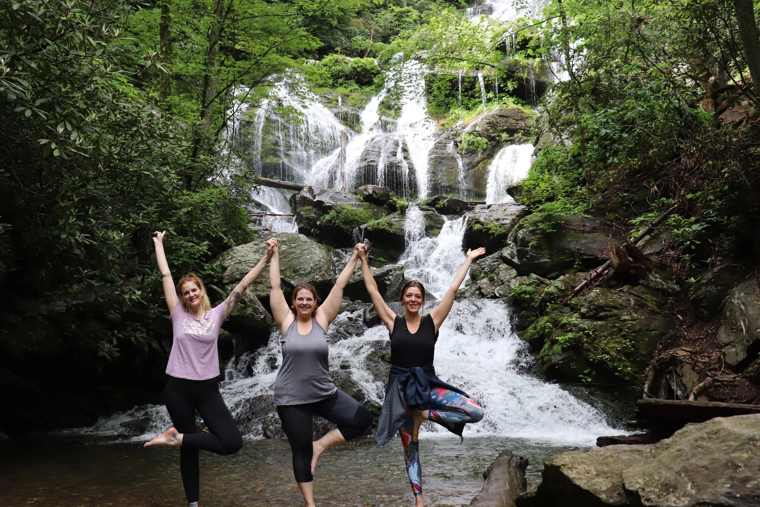 NamasteInNature_3Women_TreePose_CatawbaFalls_RelaxingWaterfallYogaHikingTour_AshevilleNC.JPG