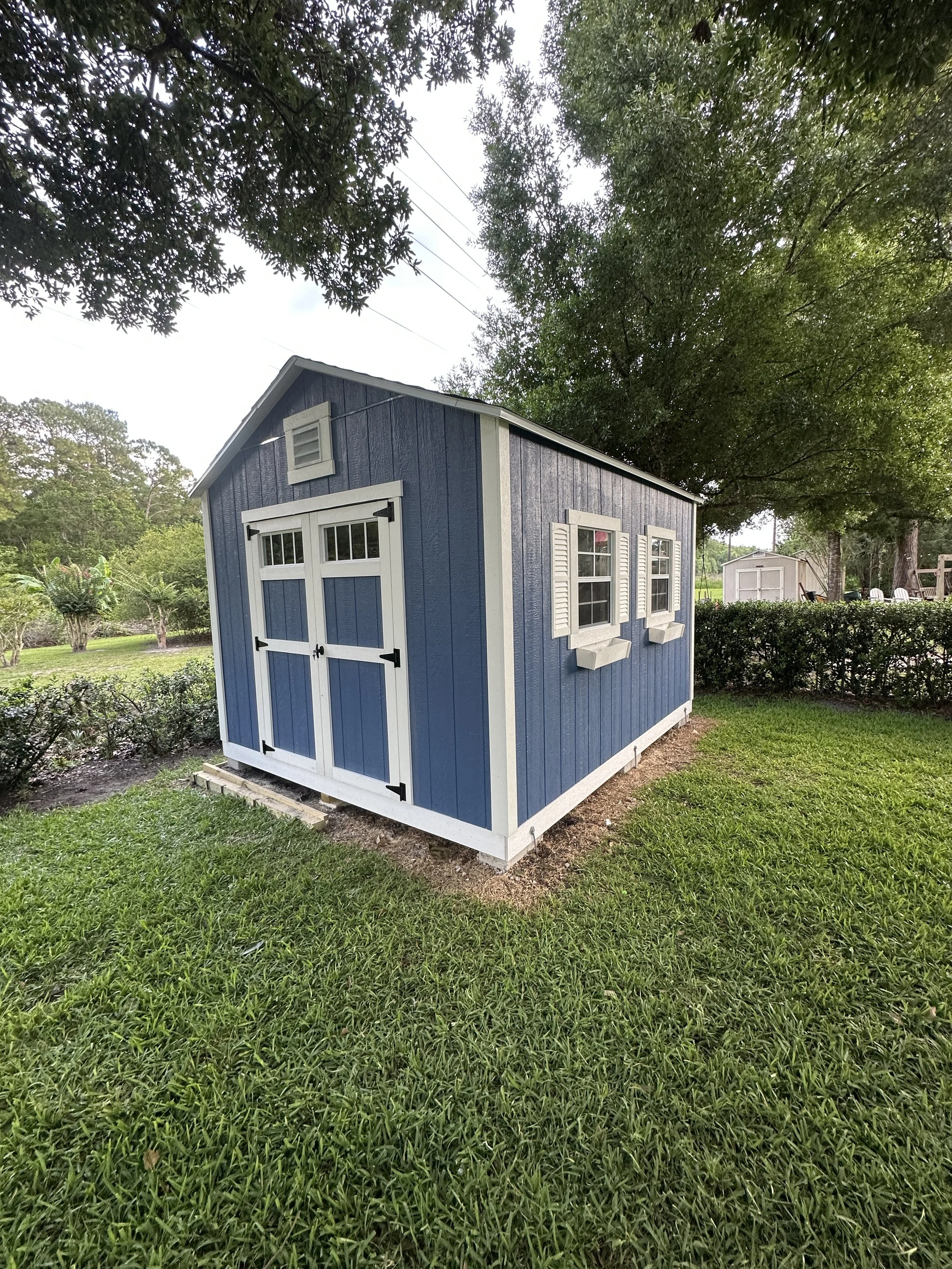 10x12 The Palmetto with Custom paint, Transom  window double doors, Window shutters and Flower boxes