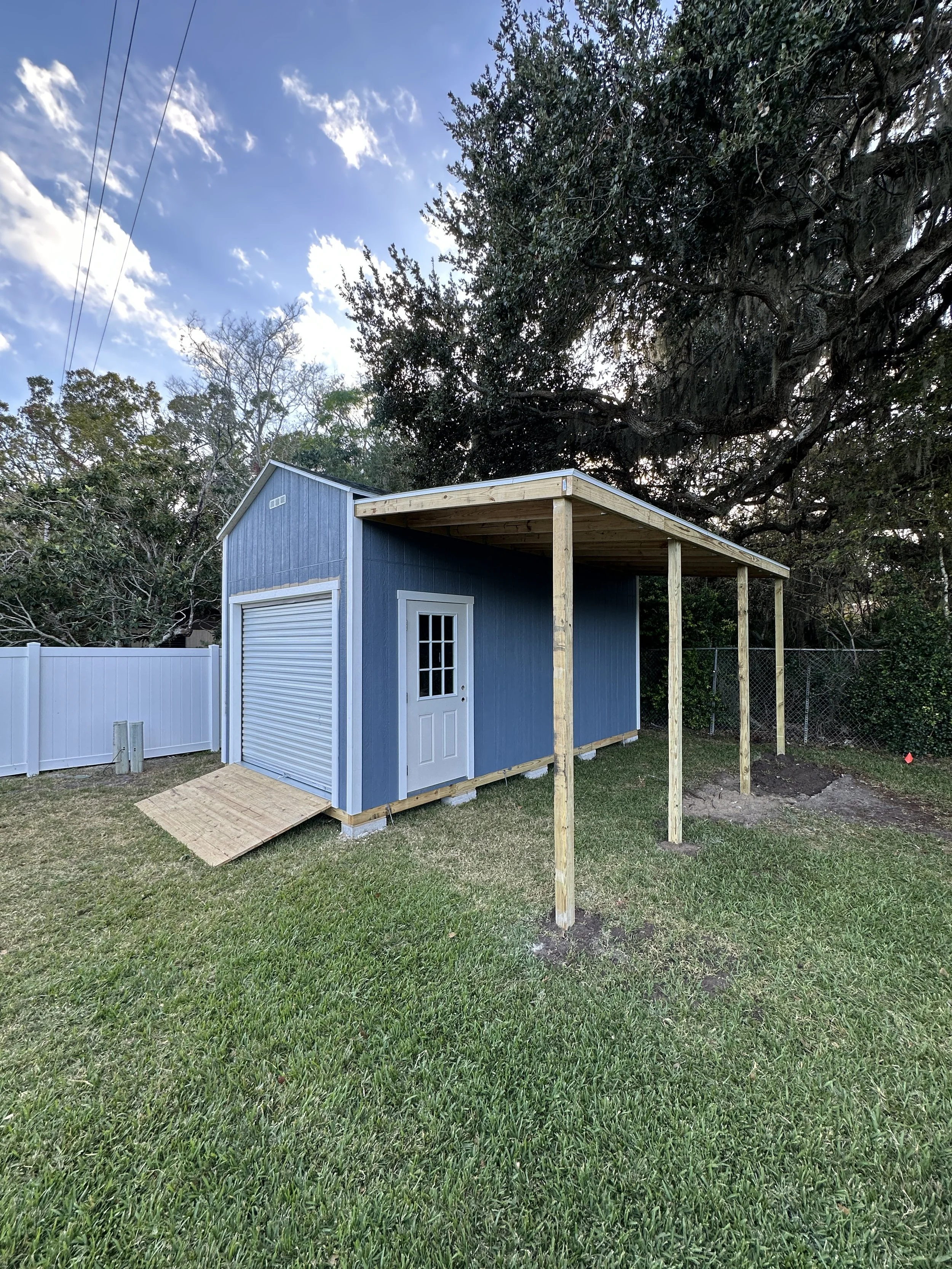 10x24 Palmetto Style with 8x7 Roll up, 36x80 residential door and 8x20 Lean to roof
