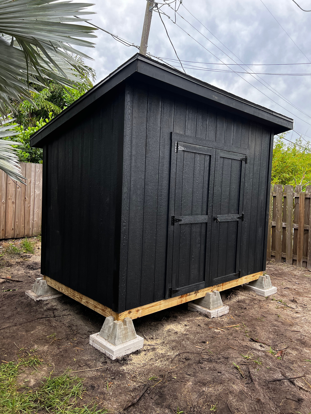 6x10 Lean to style custom painted and custom overhangs
