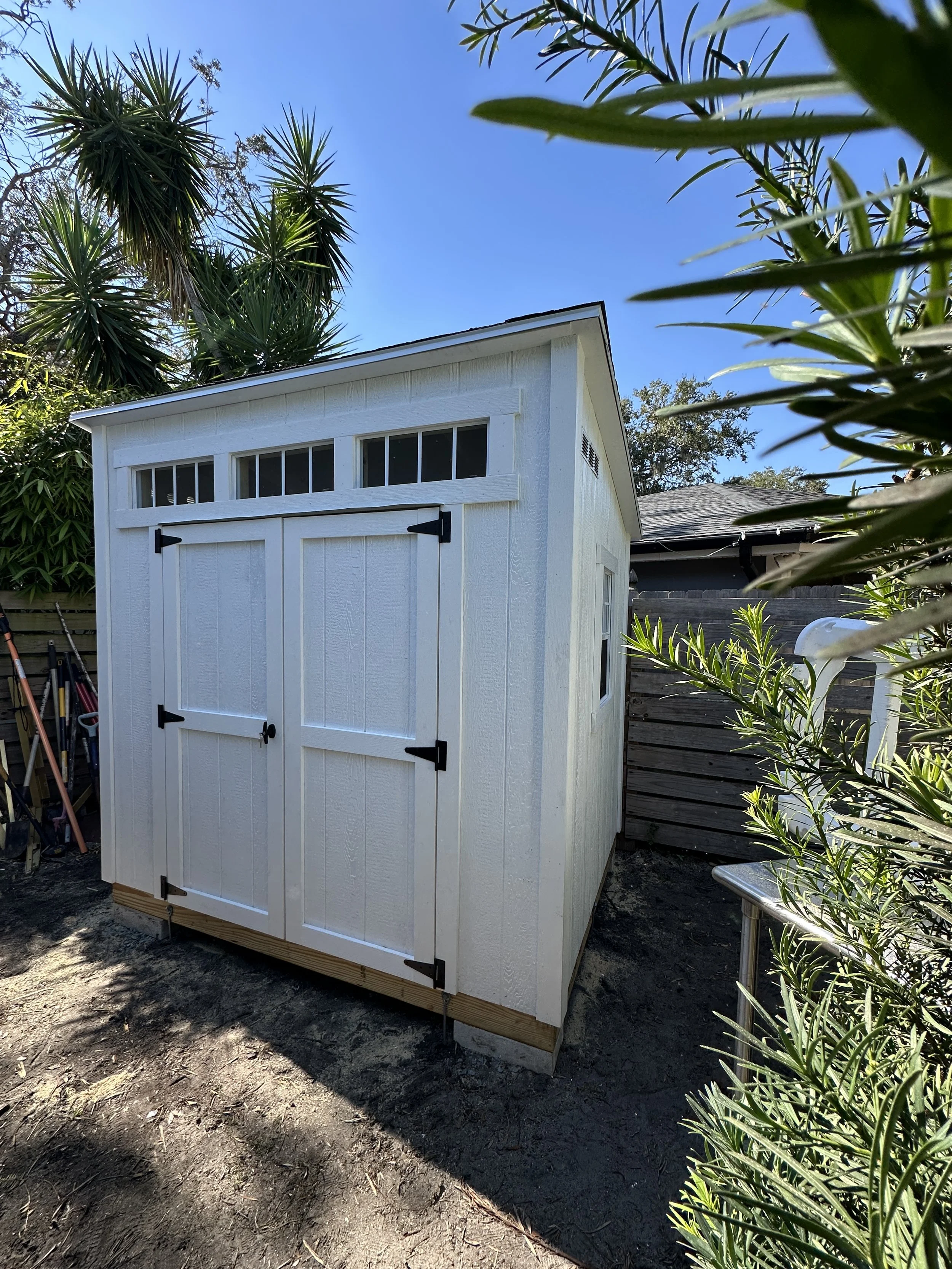 4x10 The Cove (lean to) Style with custom paint and transom windows.