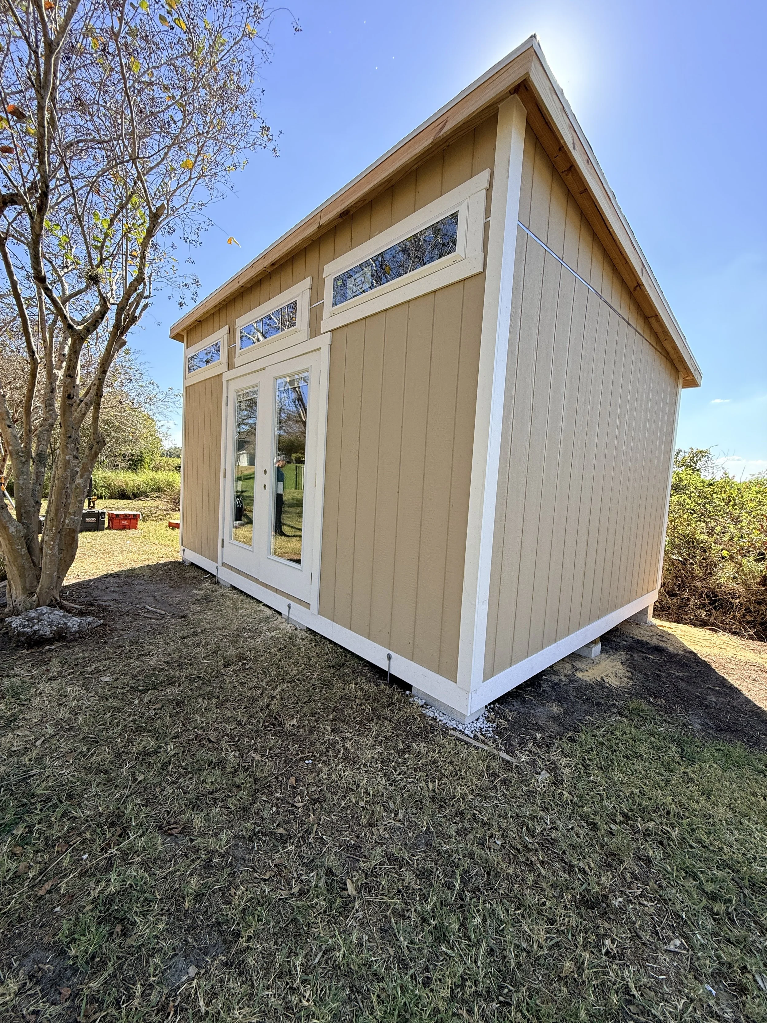 12x16 The Cove (lean to) style with Residential doors and 3 transom windows.