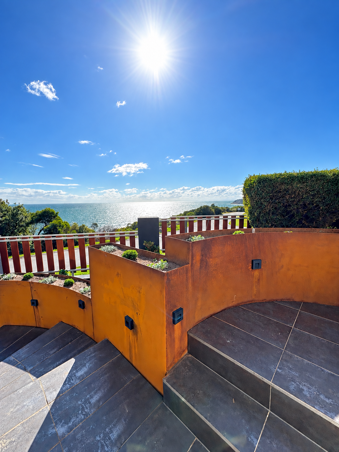 Corten steel retaining wall with natural rust patina in modern landscape design