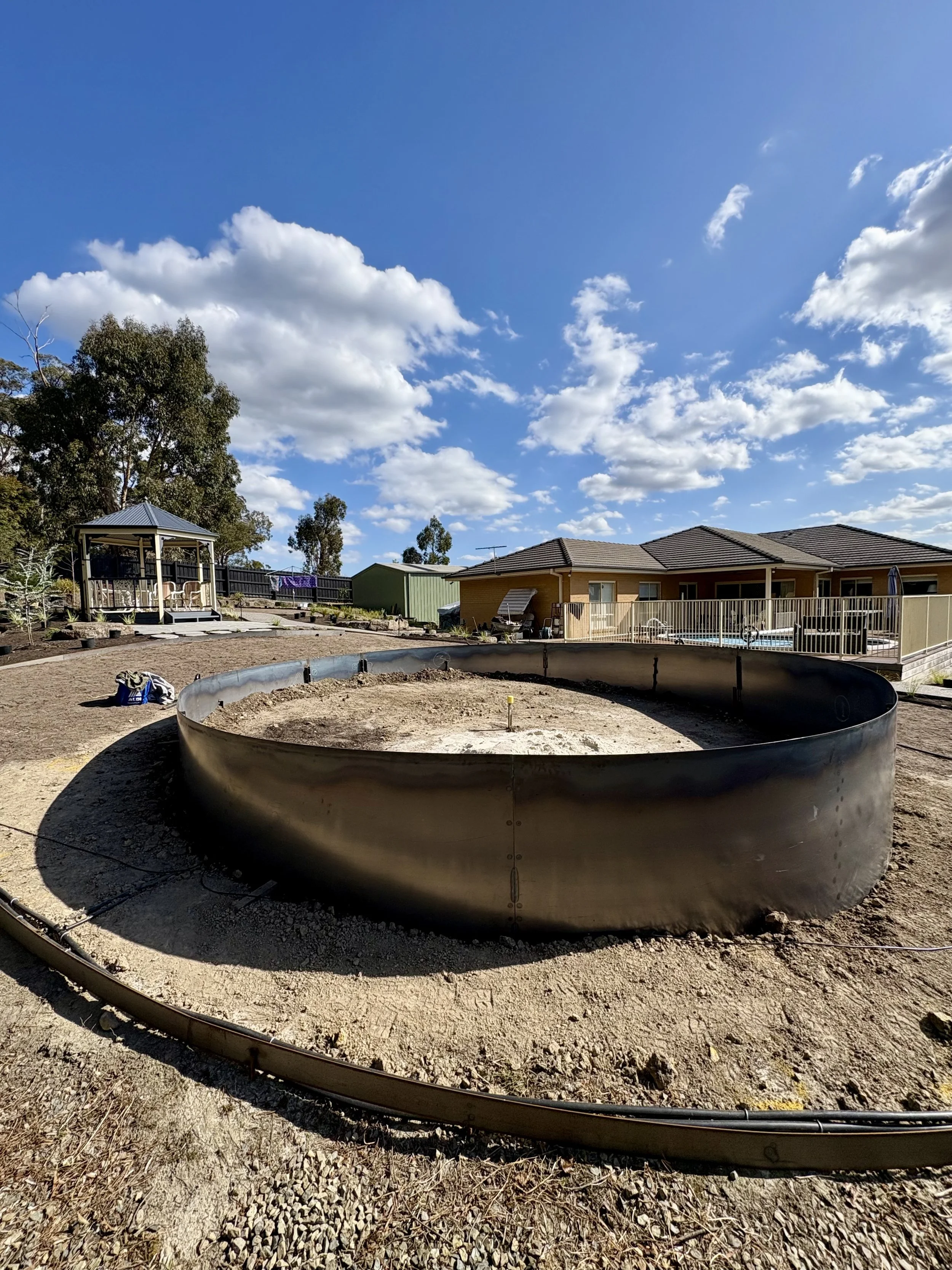 Large Corten steel ring fabricated and installed on-site at Mooroolbark.