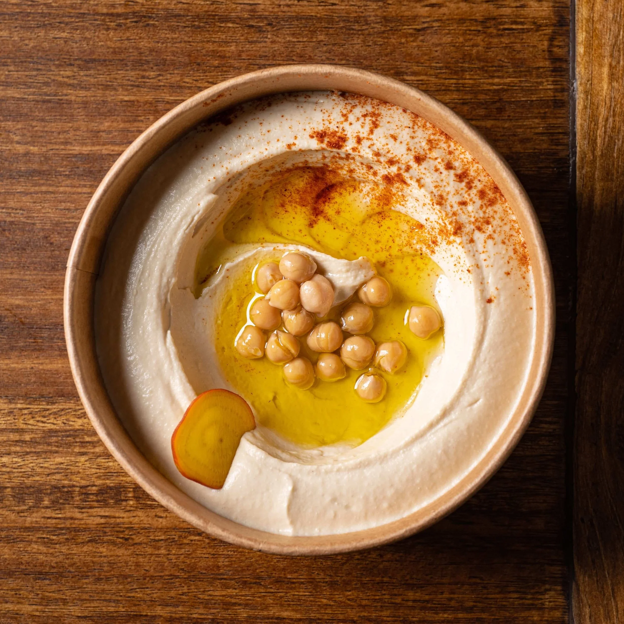  Homos dip made from chickpeas blended w/ tahini, lemon topped with paprika &amp; extra virgin olive oil 