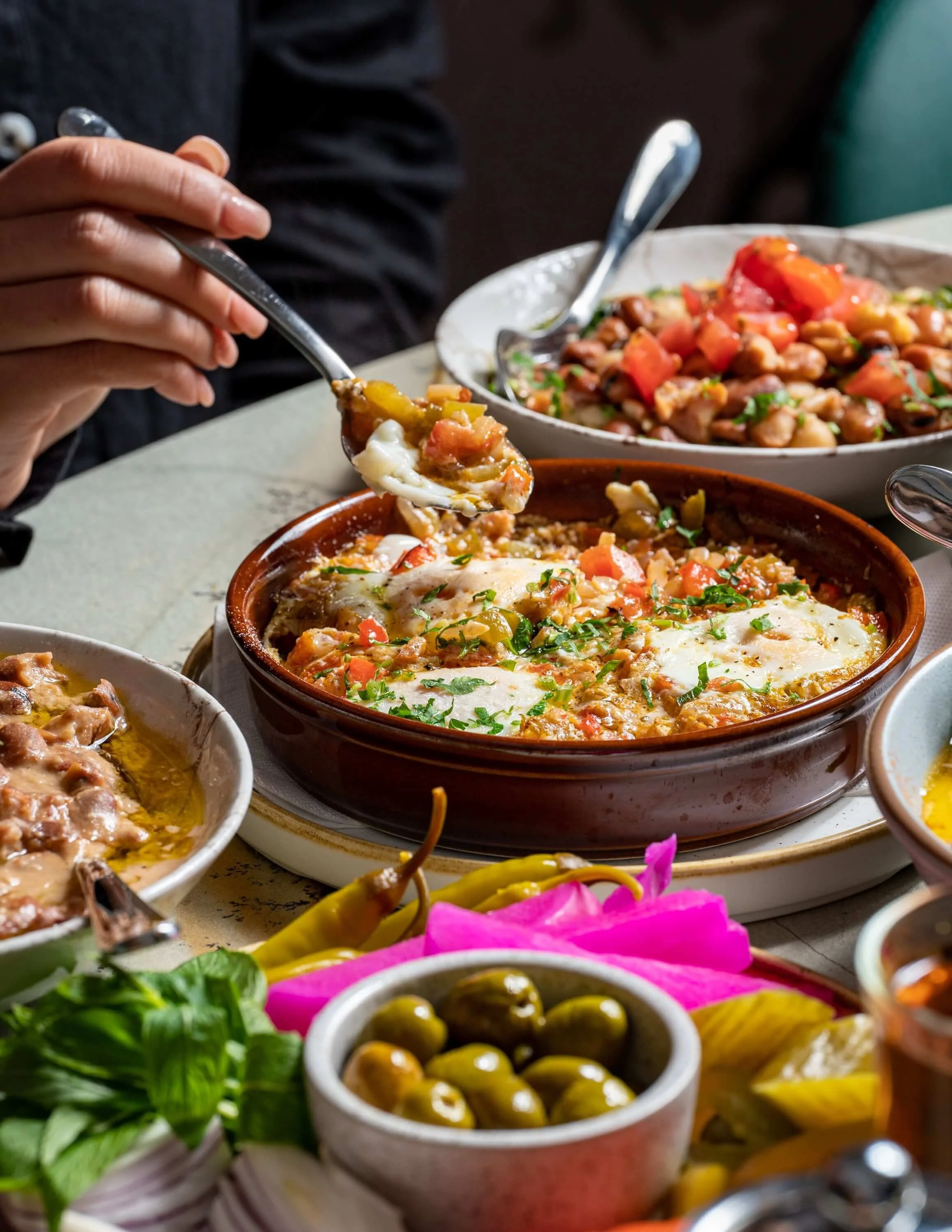  A colourful table full of mezza and dips 