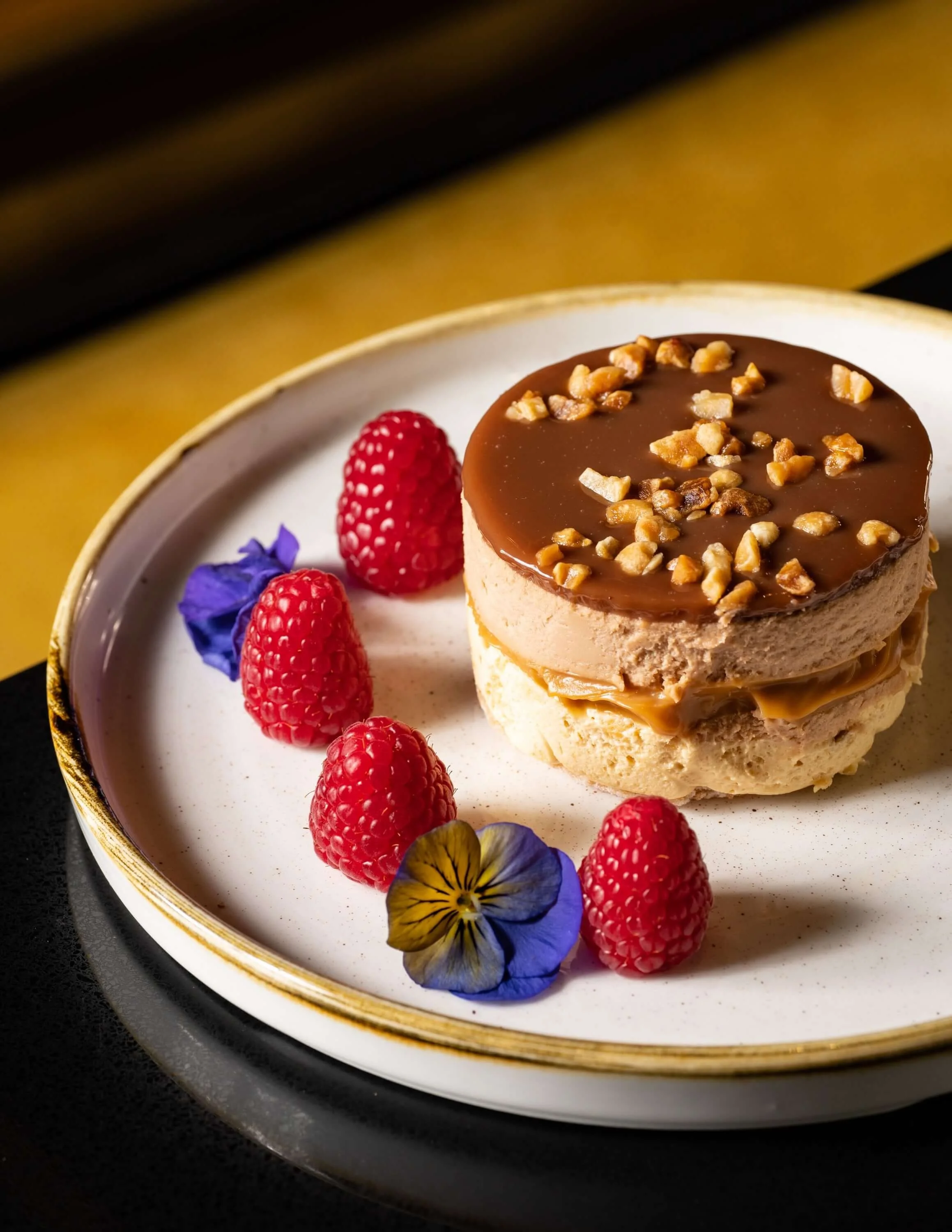  Hazel Nut mousse plated with fresh berries 