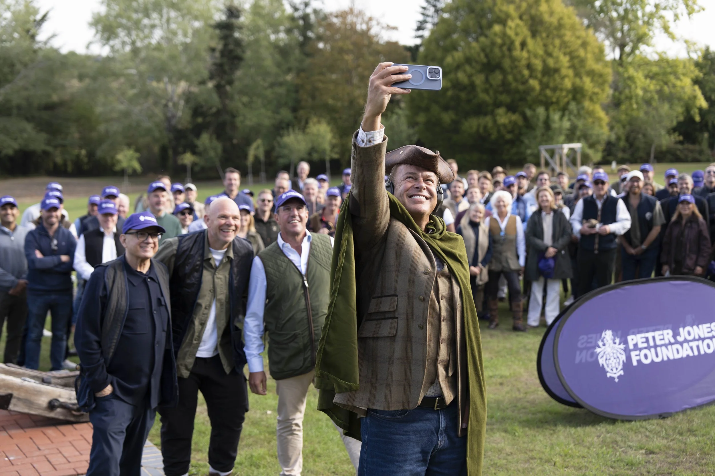 Peter Jones taking a photo with fundraisers at the annual charity shoot